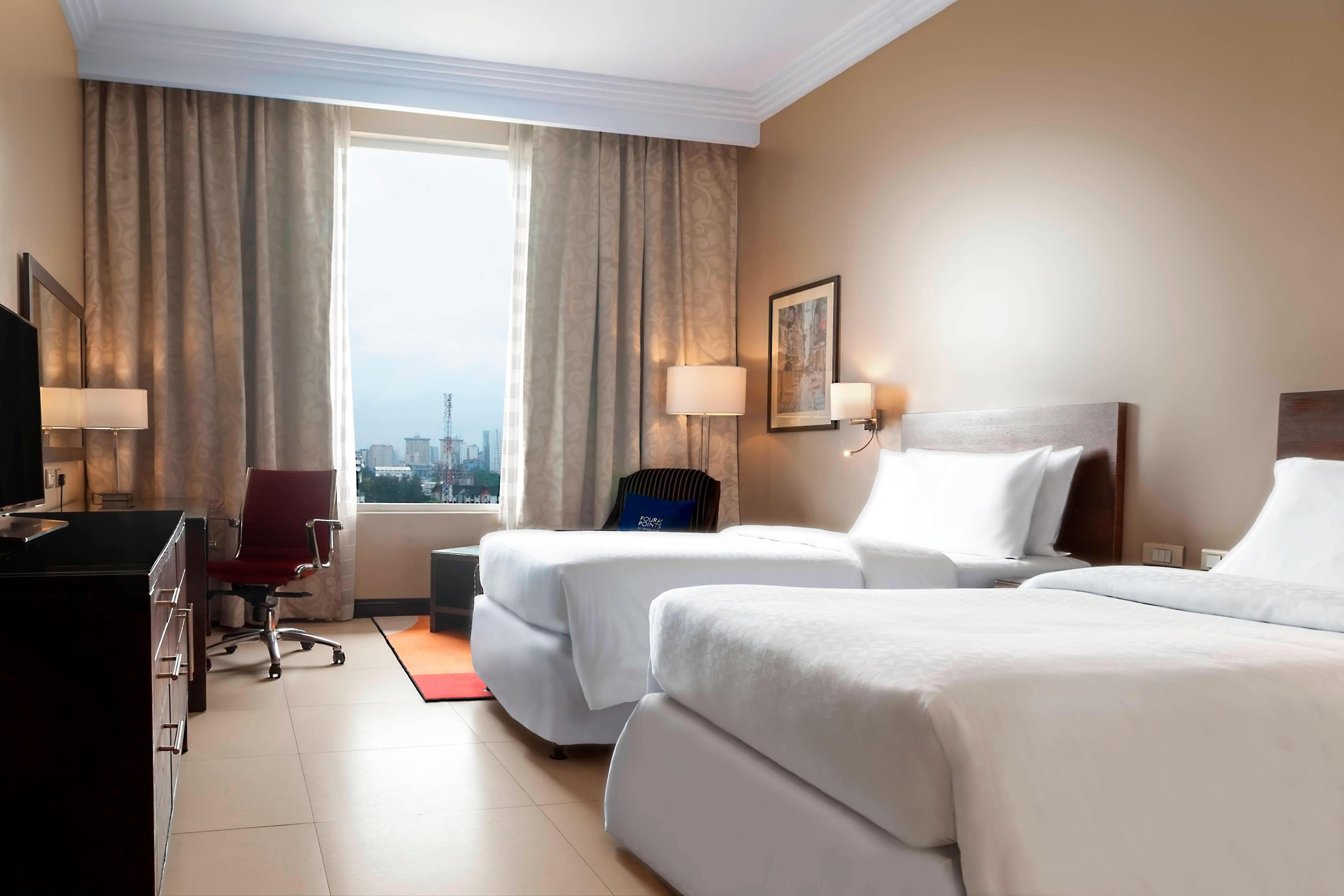 Our Executive Twin Room is connected to the King Executive Rooms and is located on the topmost floor, providing far reaching views of the stunning Victoria Island Views.