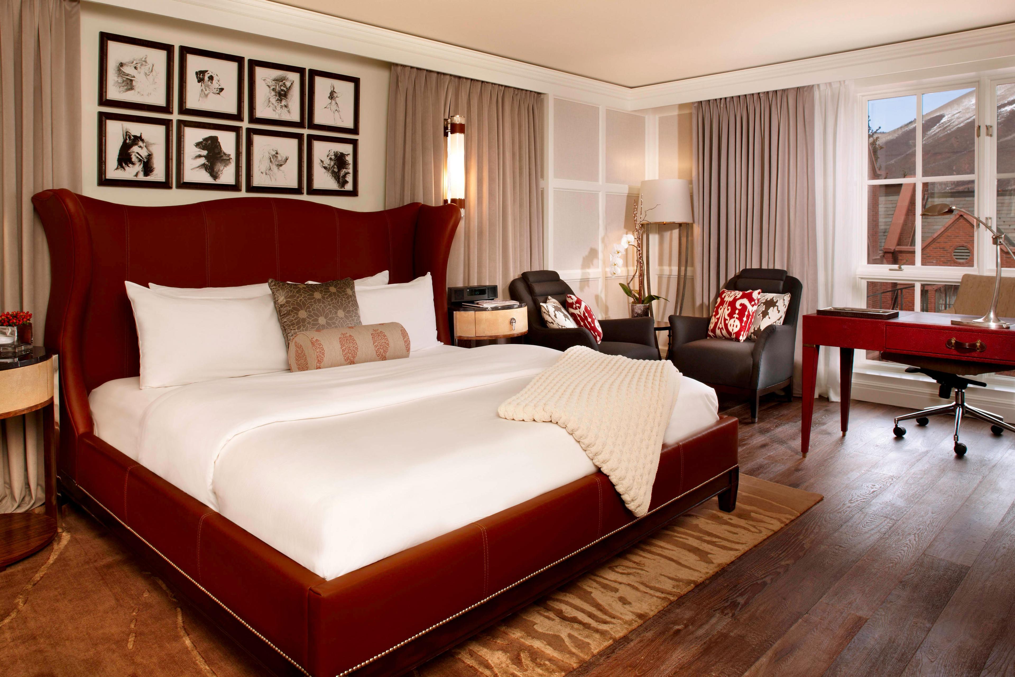 Make yourself comfortable in our Deluxe King Guest Room, outfitted with custom furnishings, including a leather bed and desk designed by Ralph Lauren.
