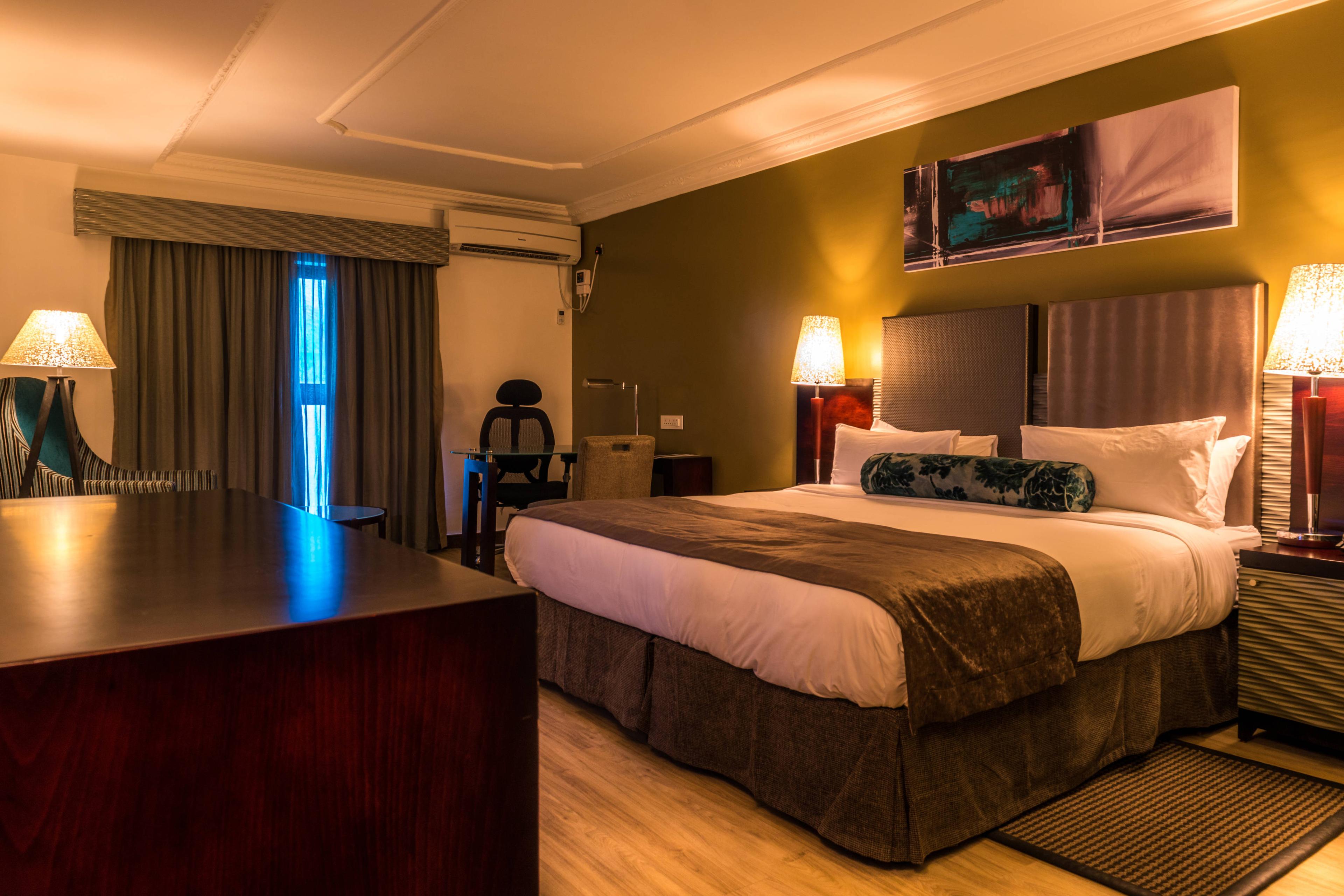 Catch up on some work in the Absolute Superior Guest Room, which comes standard with a work desk and queen size bed.