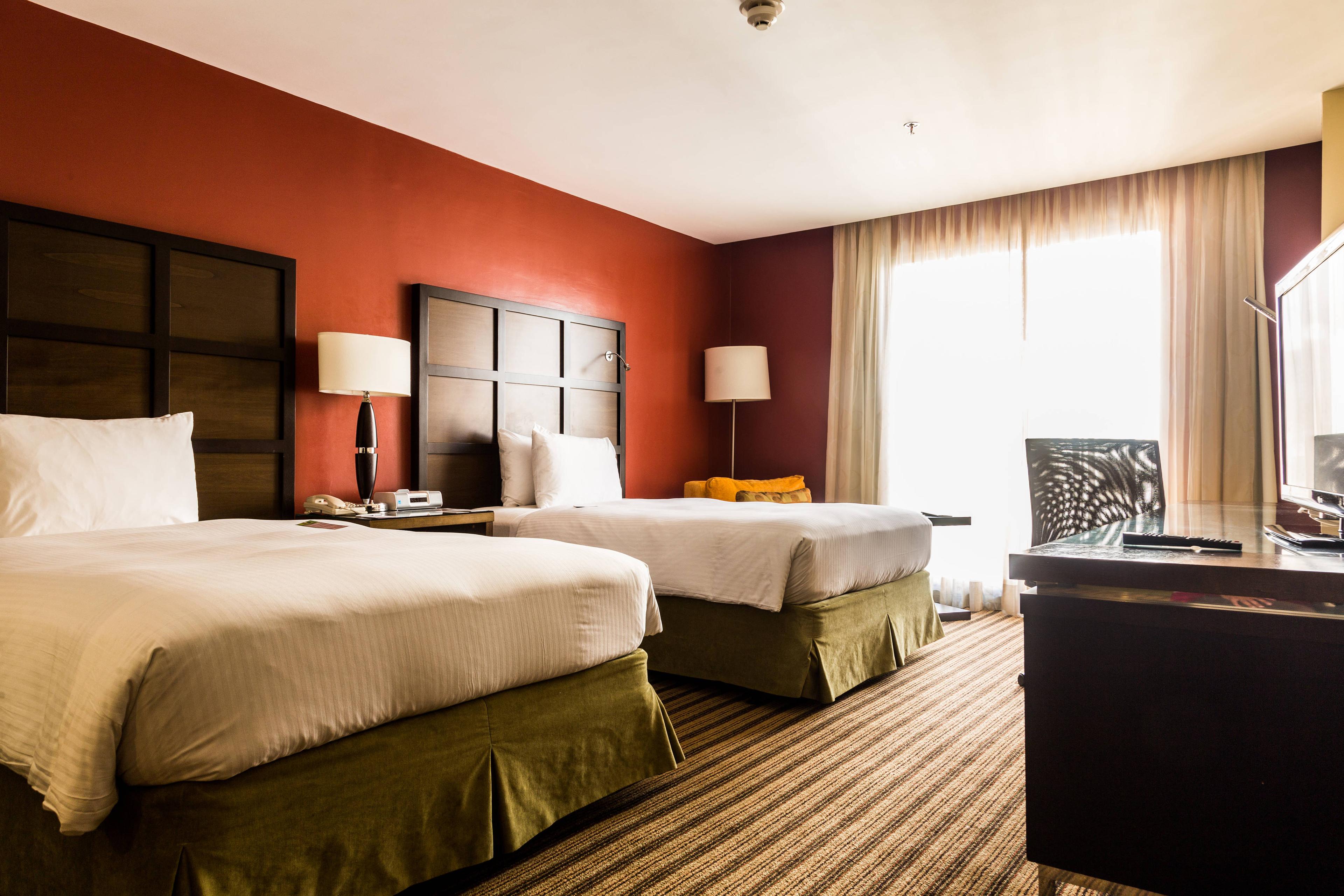Discover the style and comfort in our spacious rooms with two queen-size king-size beds, ultra-luxurious bedding and pillows, a 42-inch LCD TV, iPod dock and high-speed Internet access.