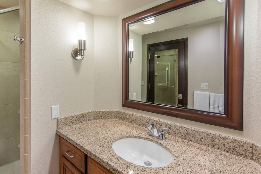 The master bathroom is elegantly appointed with stylish fixtures, extra vanity space and an oversized soaking tub.