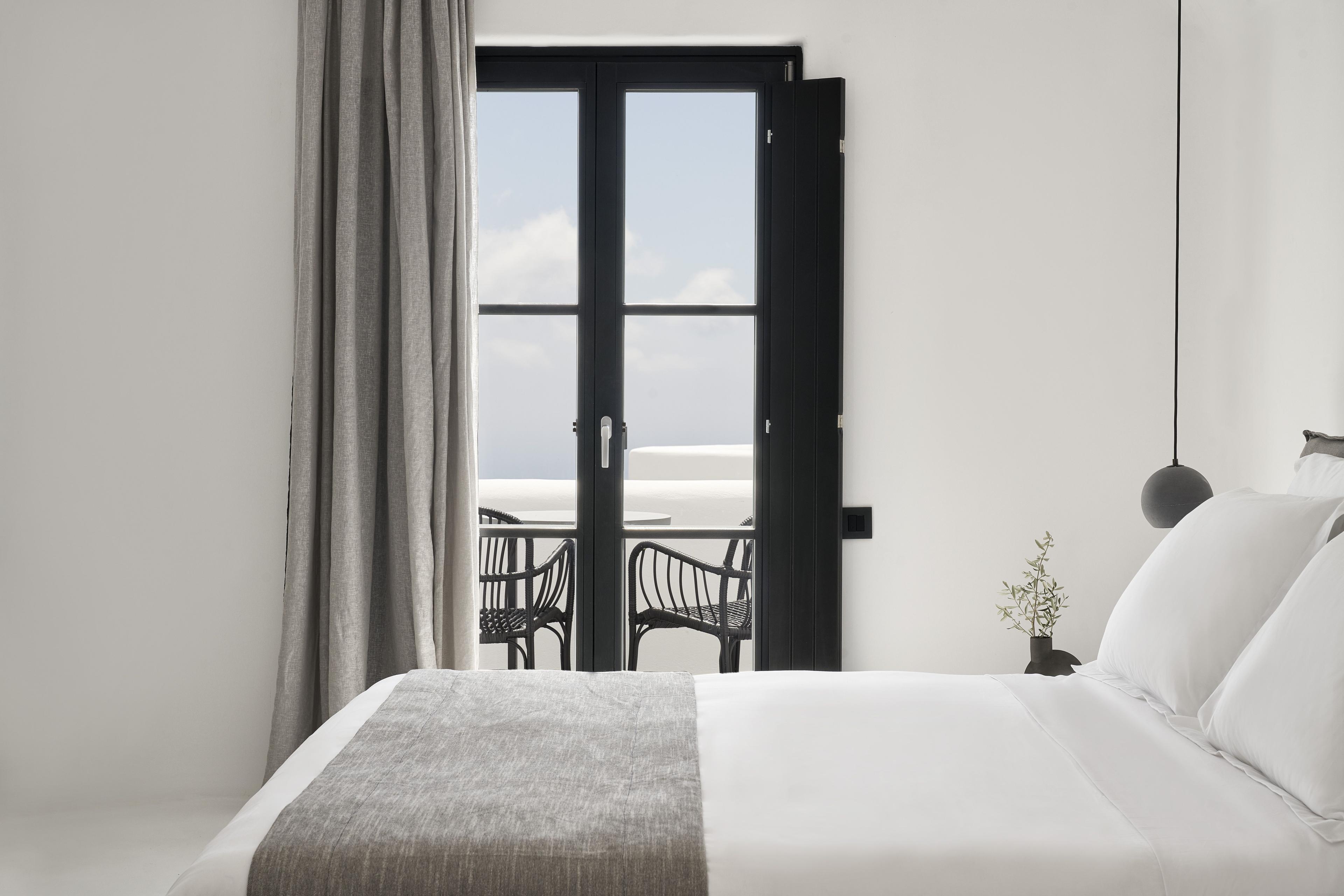 Situated on the first floor, our Deluxe rooms features a king size bed and a bathroom with luxury toiletries. This Deluxe Room opens out to a spacious terrace, boasting incredible views to the Caldera and the Aegean Sea.