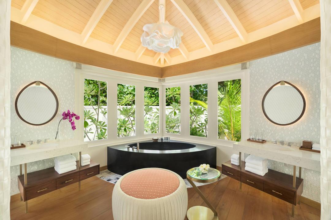 Guests can indulge and feel revitalized in the luxurious bathrooms of the beach pool villas offering a large rain shower, separate bath tub and spacious vanities.