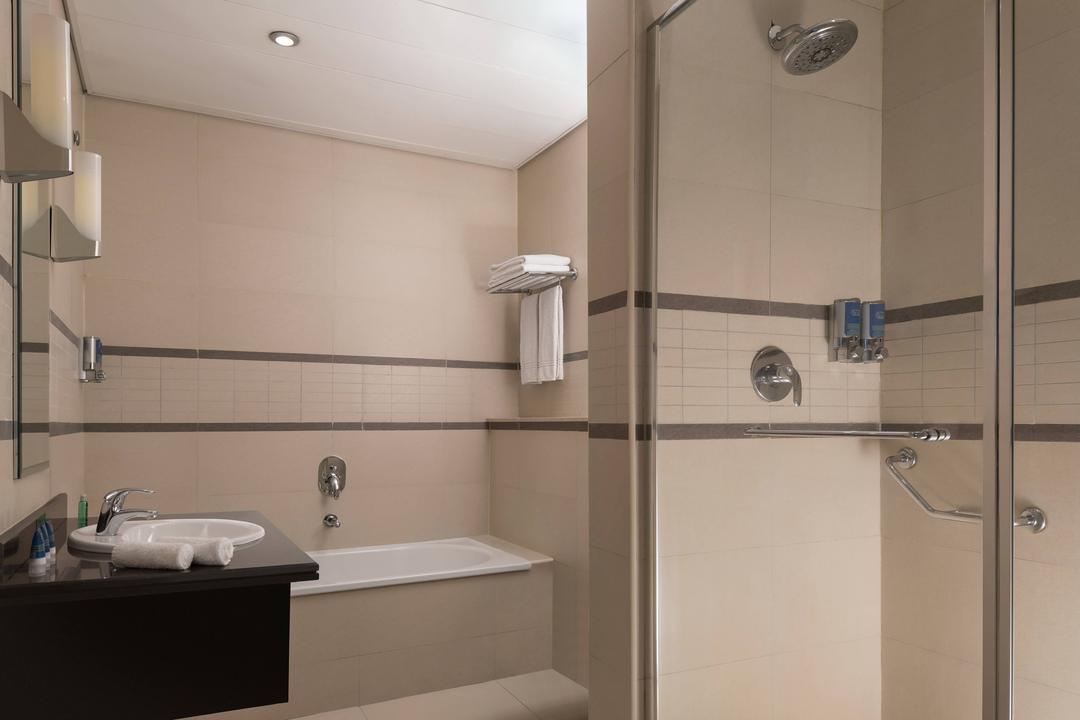 Pamper yourself in the bathroom with great amenities, separate bathtub and a walk in shower