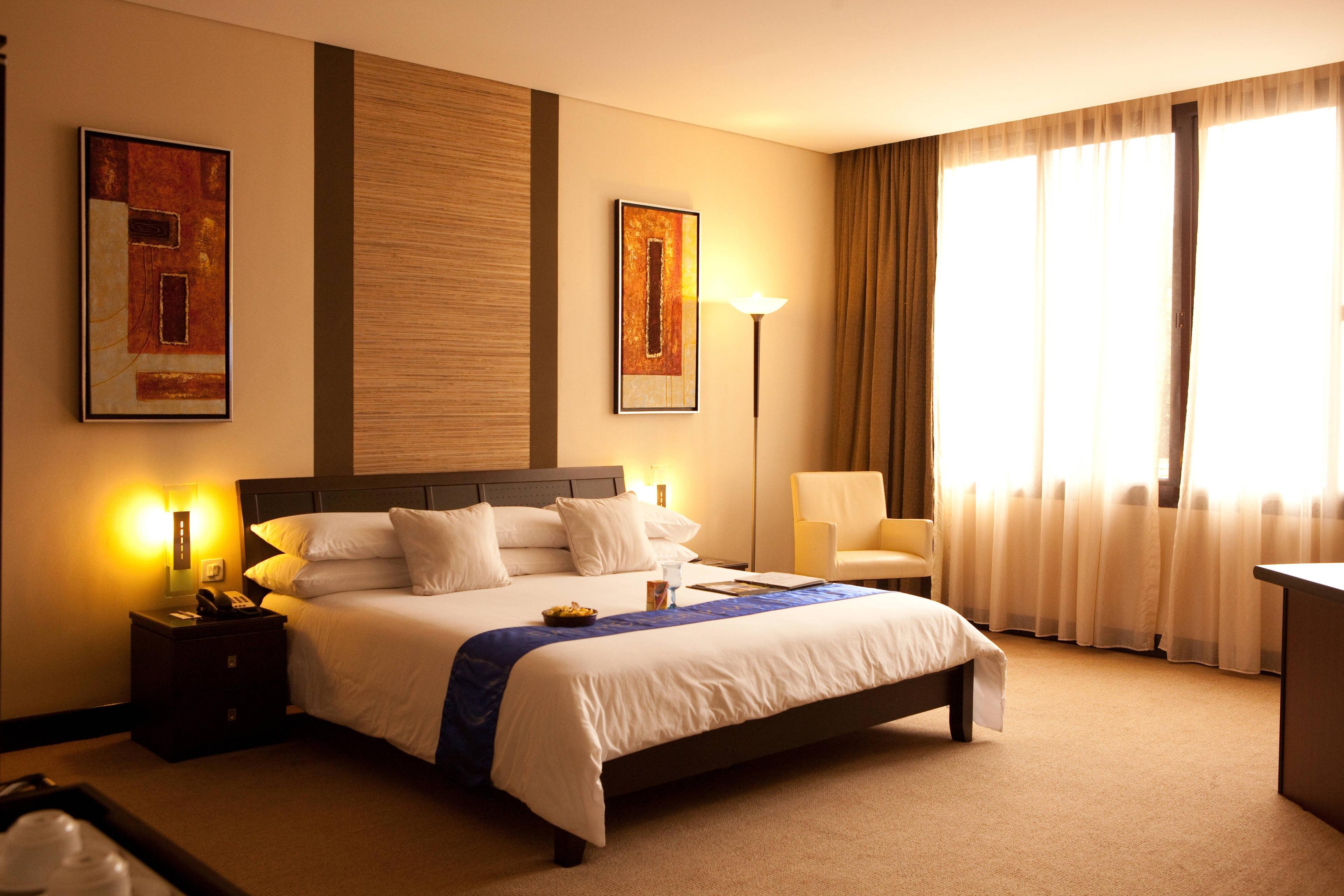 All hotel rooms are air-conditioned with en suite bathrooms and writing desks.