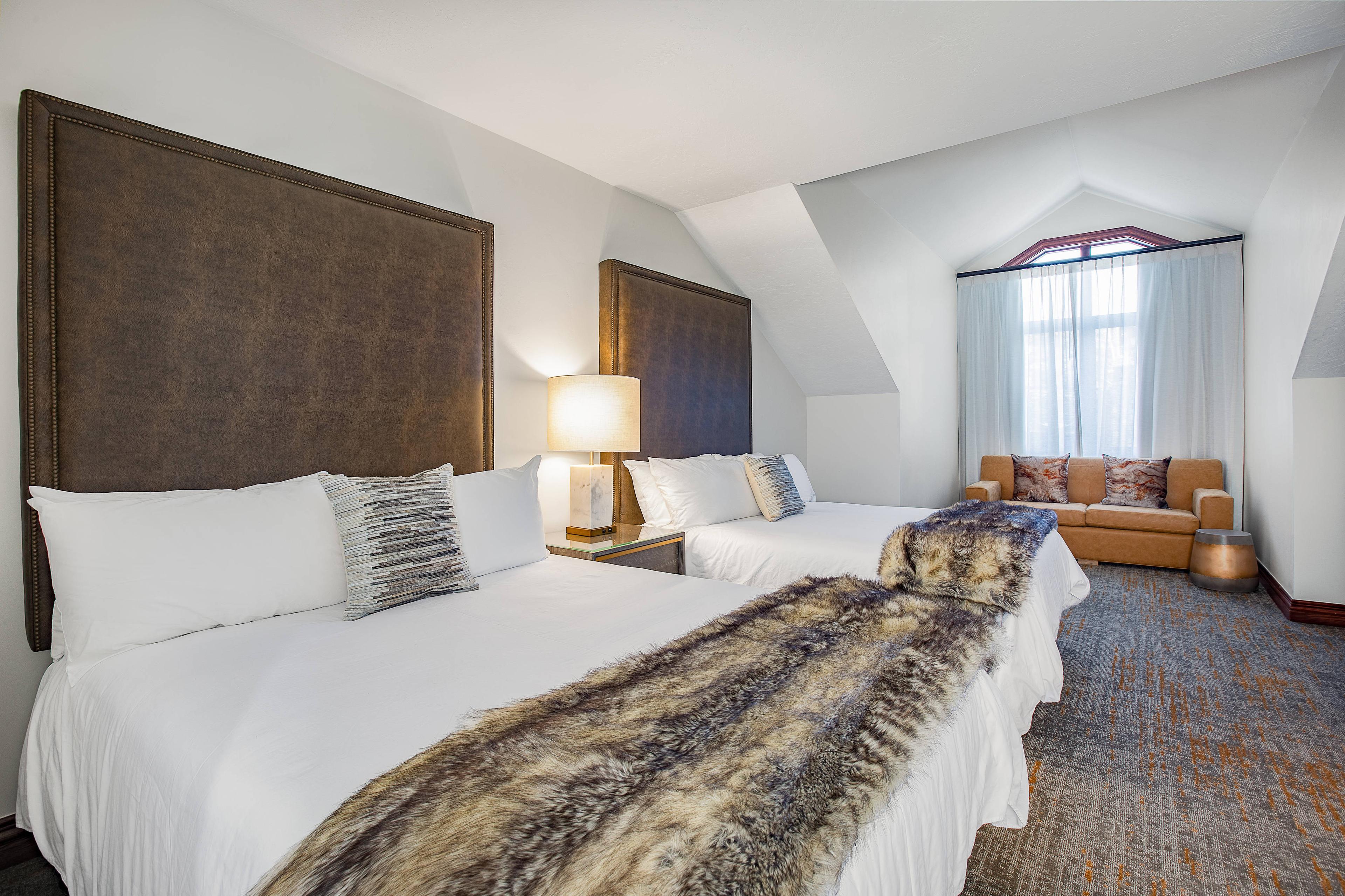 Wrap yourself in a faux fur throw and enjoy the luxurious accommodations in our spacious suite with two separate rooms.