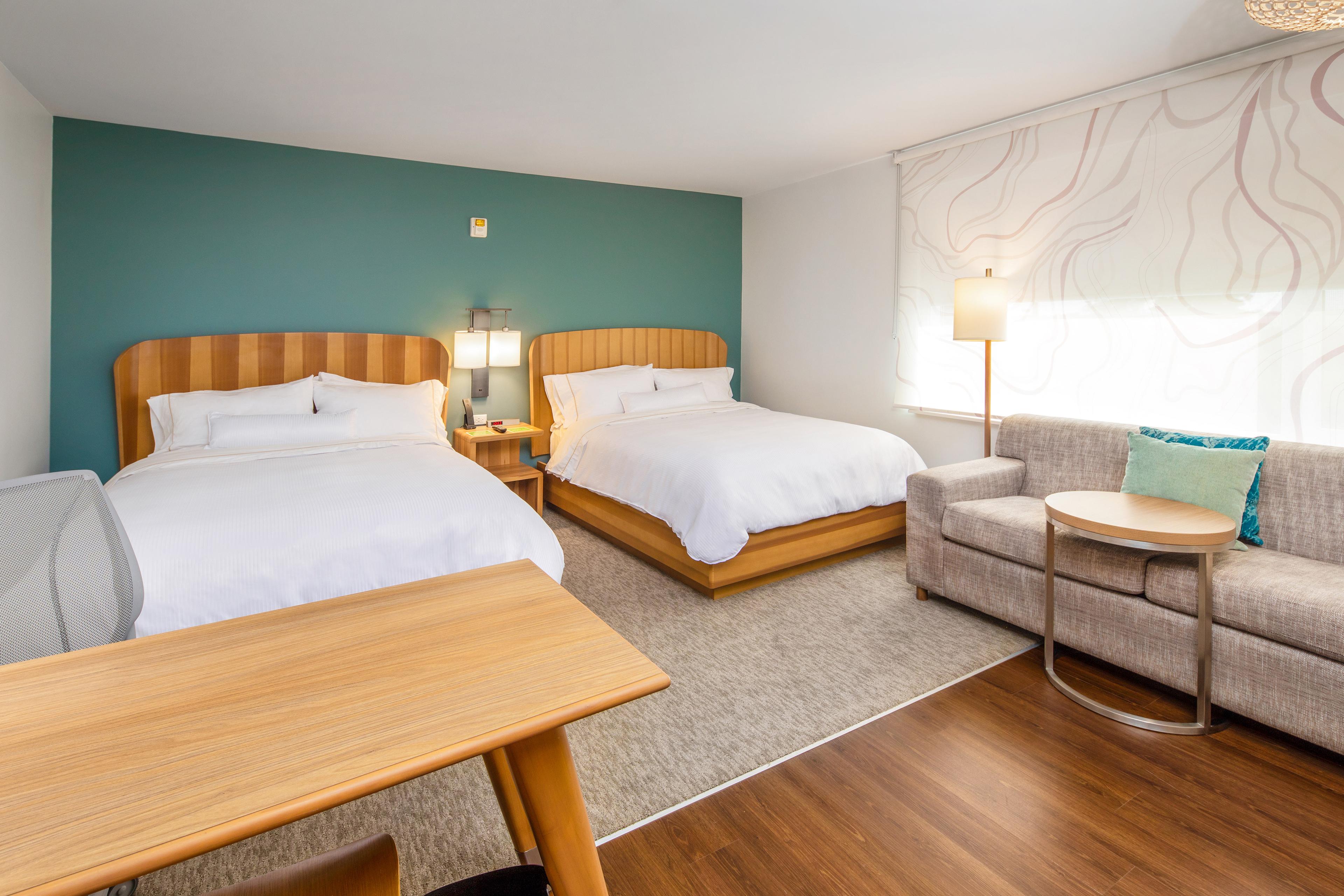 If you're traveling with companions, you'll appreciate our queen/queen studio rooms, featuring large tables, comfy couches and plenty of room for everyone to spread out.