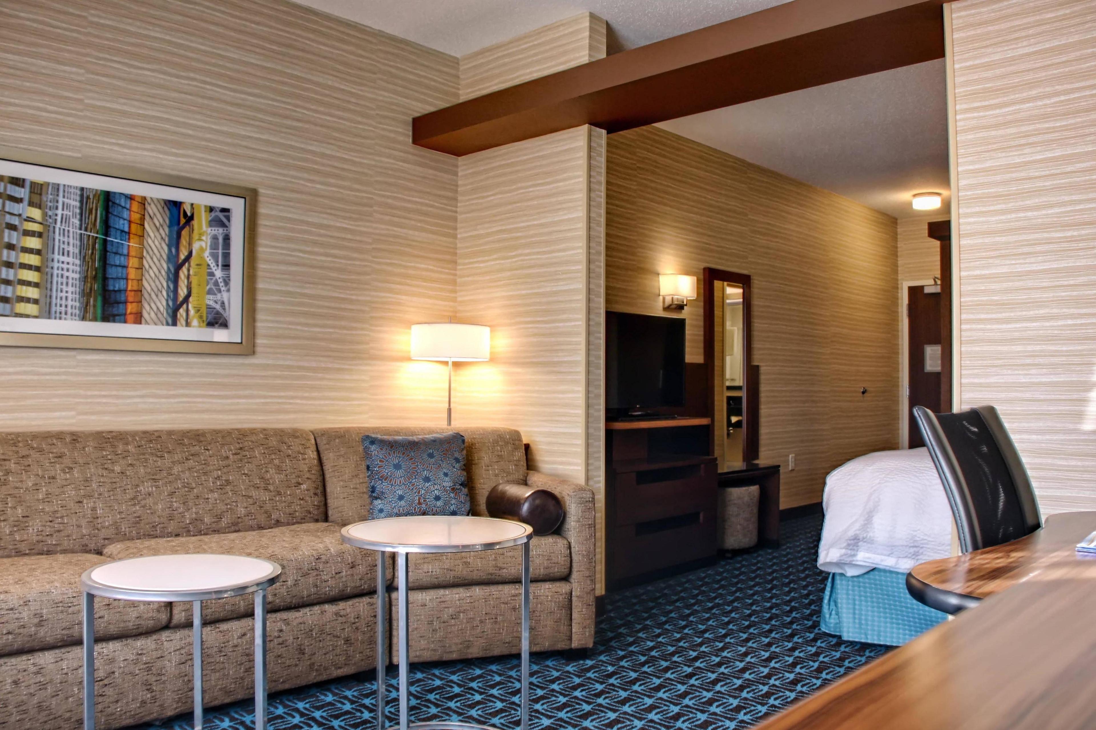 Our spacious King Suite allow you to relax and watch one of two televisions. A refrigerator and microwave are in every room for your convenience.