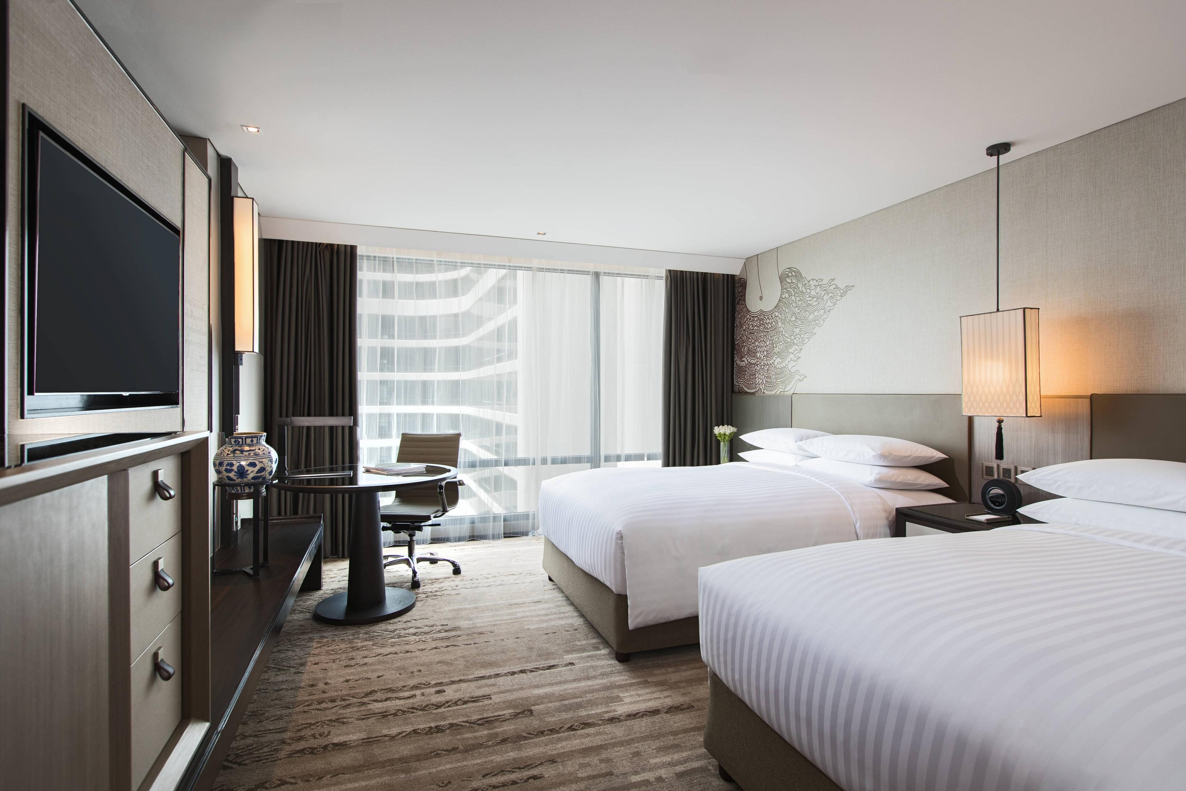 Our Double/Double Deluxe Guest Rooms provide a brilliant blend of functionality and style. All rooms feature floor-to-ceiling windows, the latest technology and our luxurious Revive bedding collection.