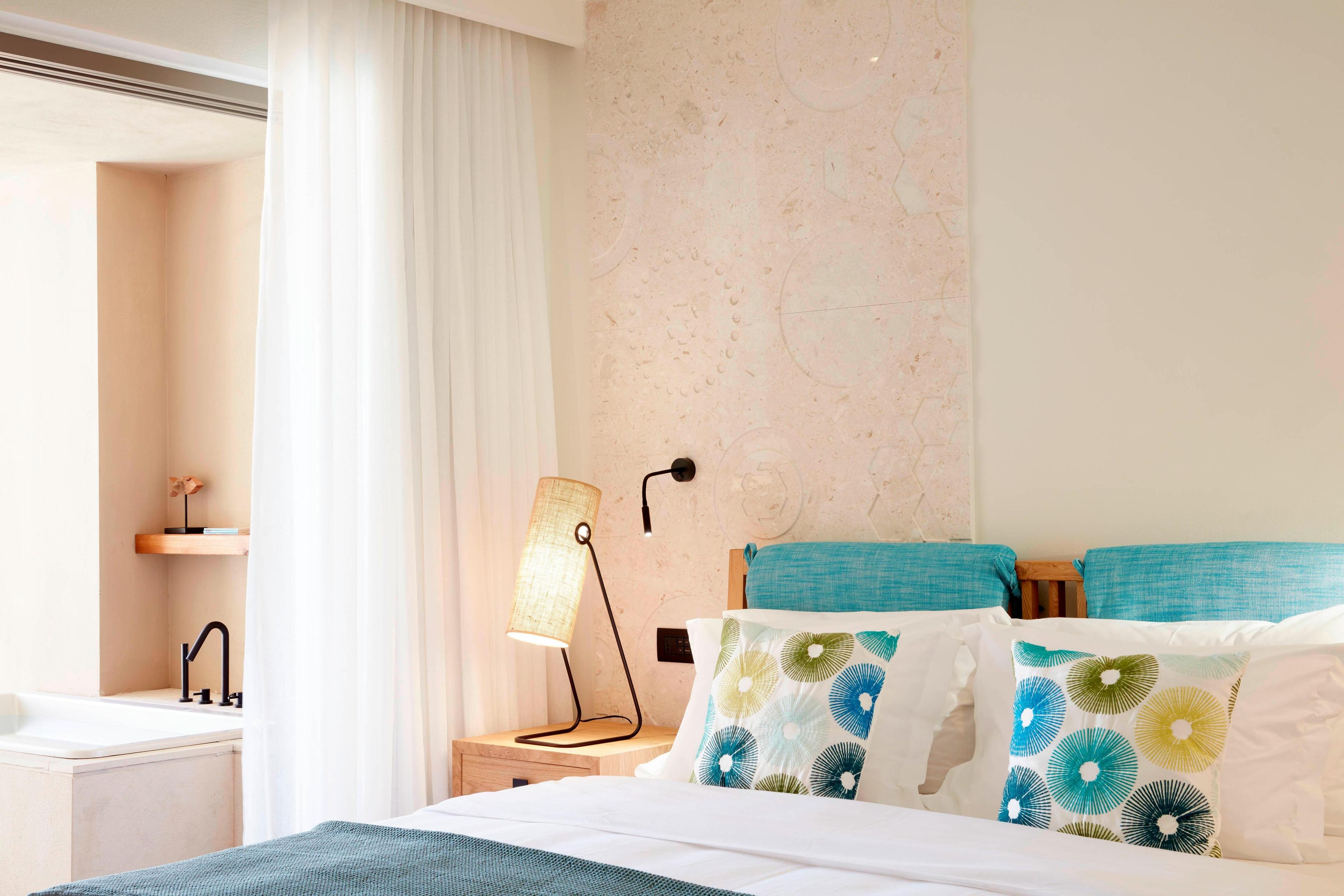 The guest rooms design offers a contemporary approach Inspired by Crete's traditional colors and patterns.