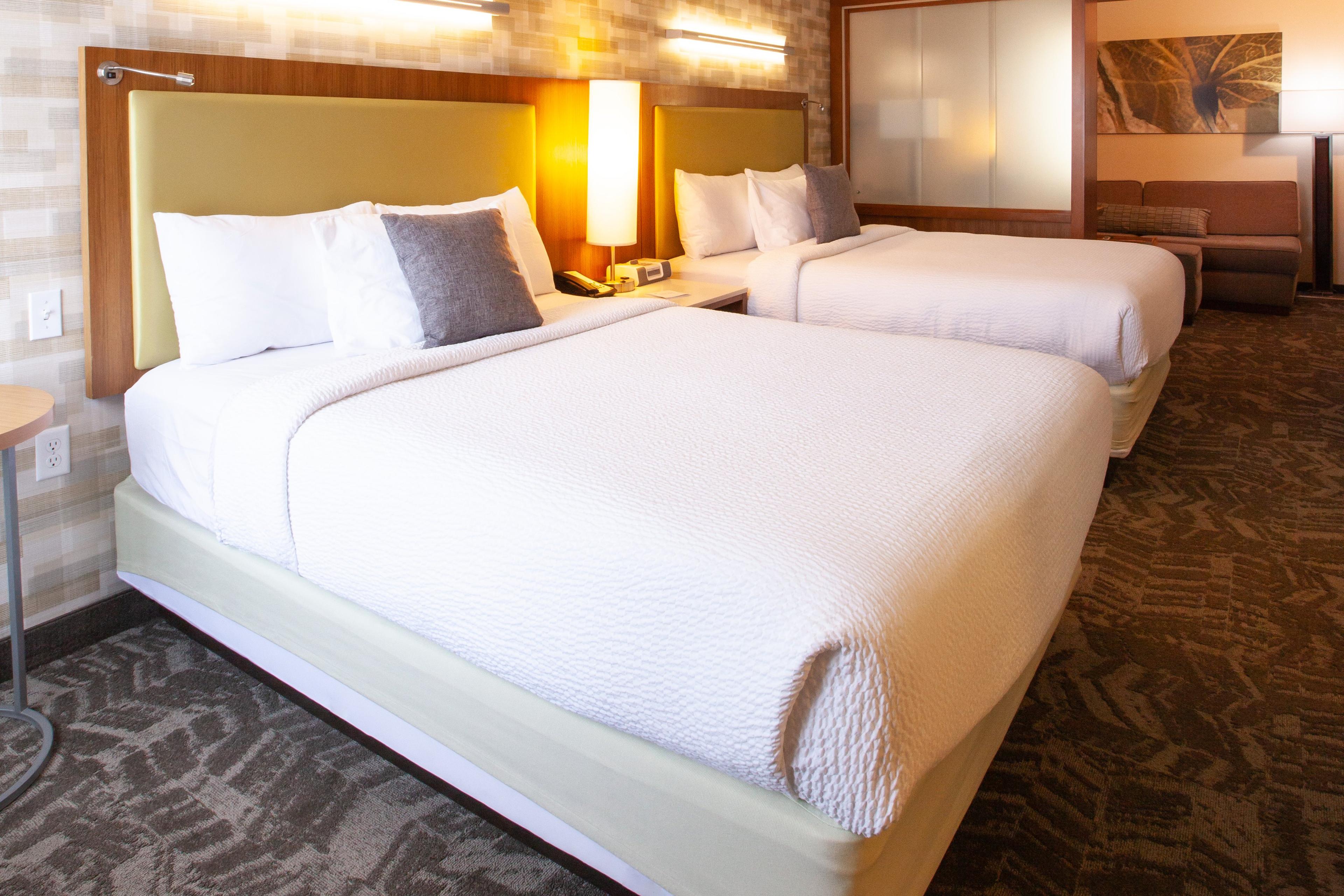 Enjoy staying in a suite with two queen-size beds in a separate sleeping area.