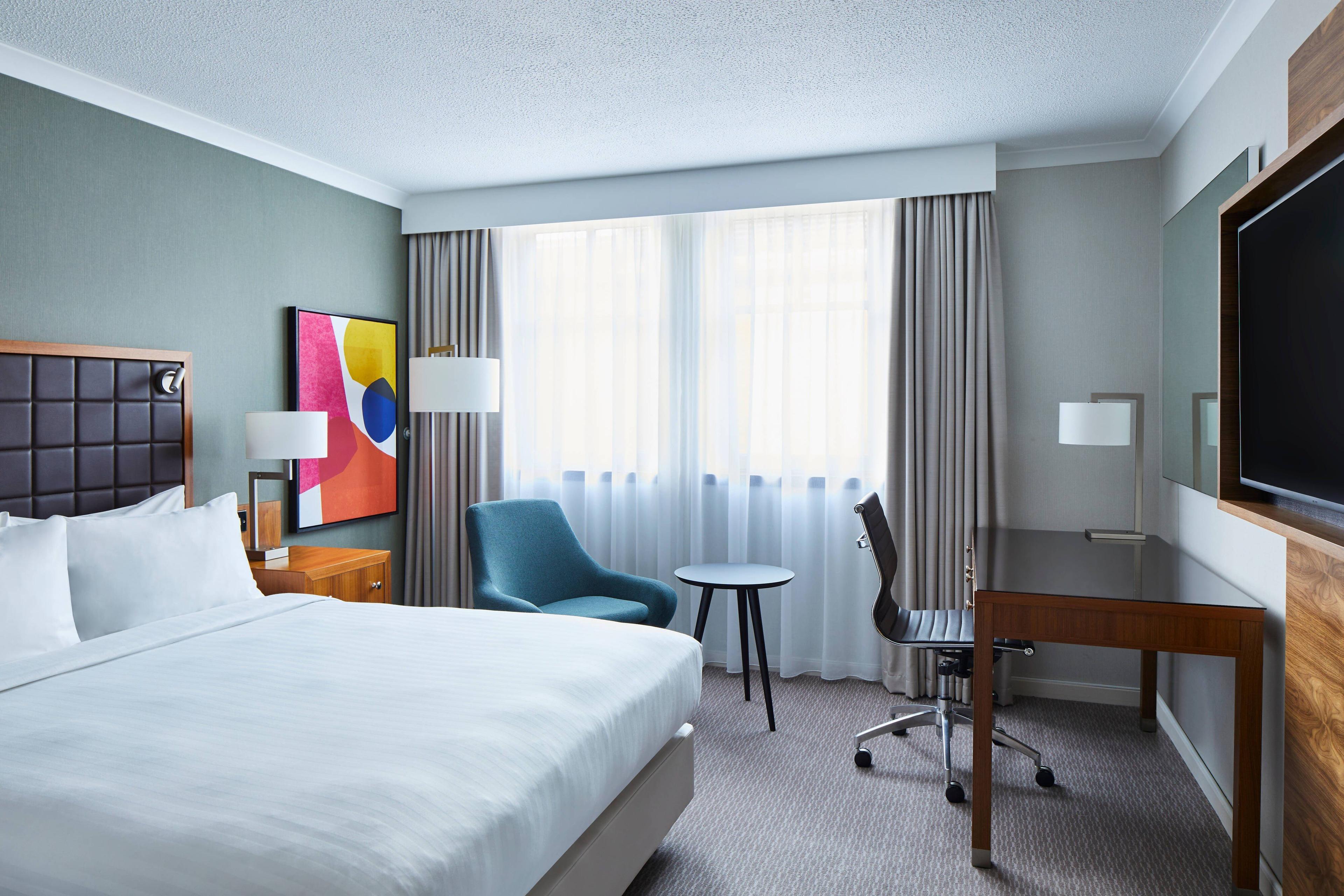 Stay in a spacious and comfortable Deluxe Queen guest room with high speed Wi-Fi access, and stay productive with a work space and an ergonomic chair.