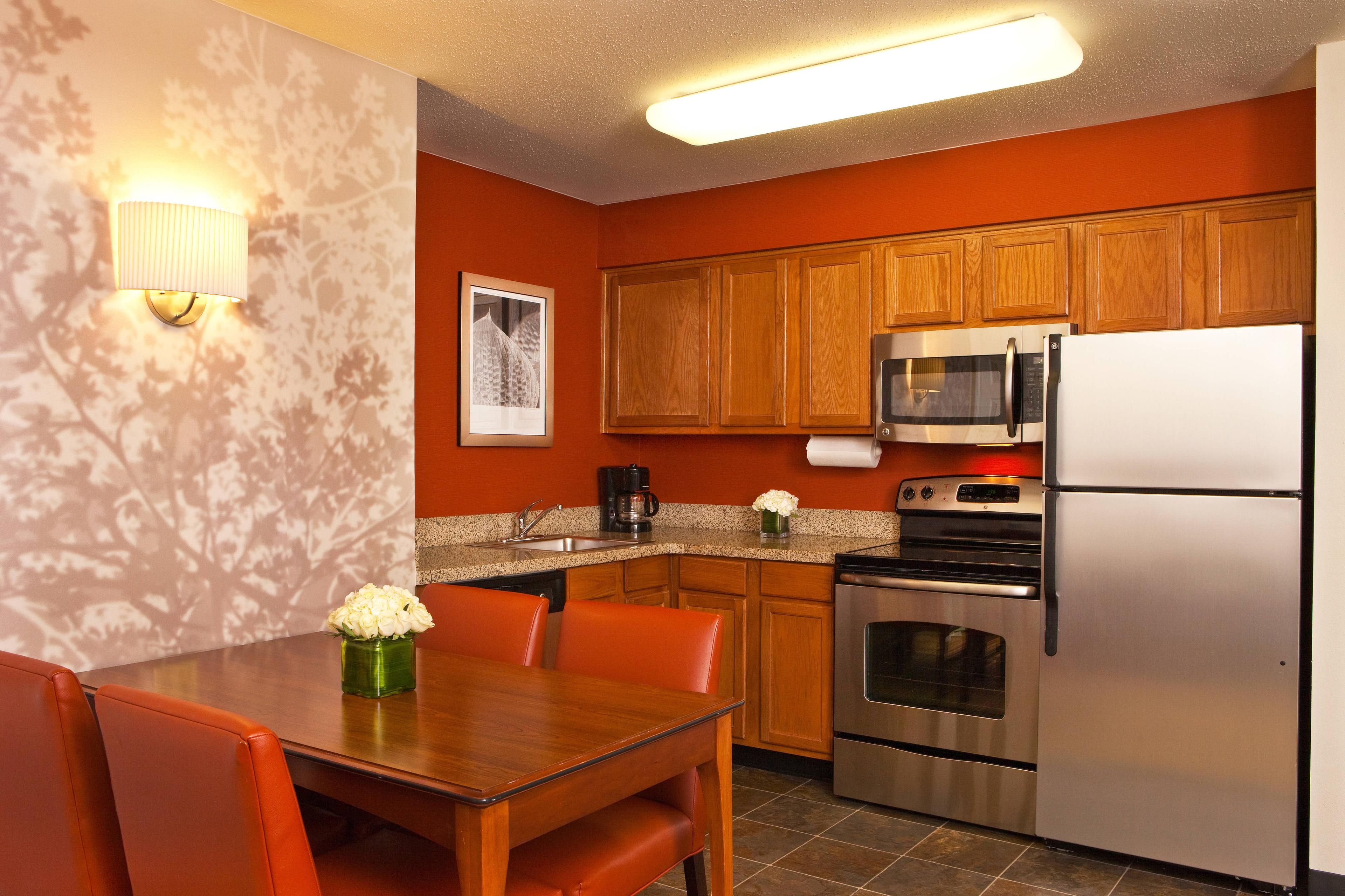 Our Two-Bedroom Suite features a fully-equipped kitchen along with a dining table that seats four people.