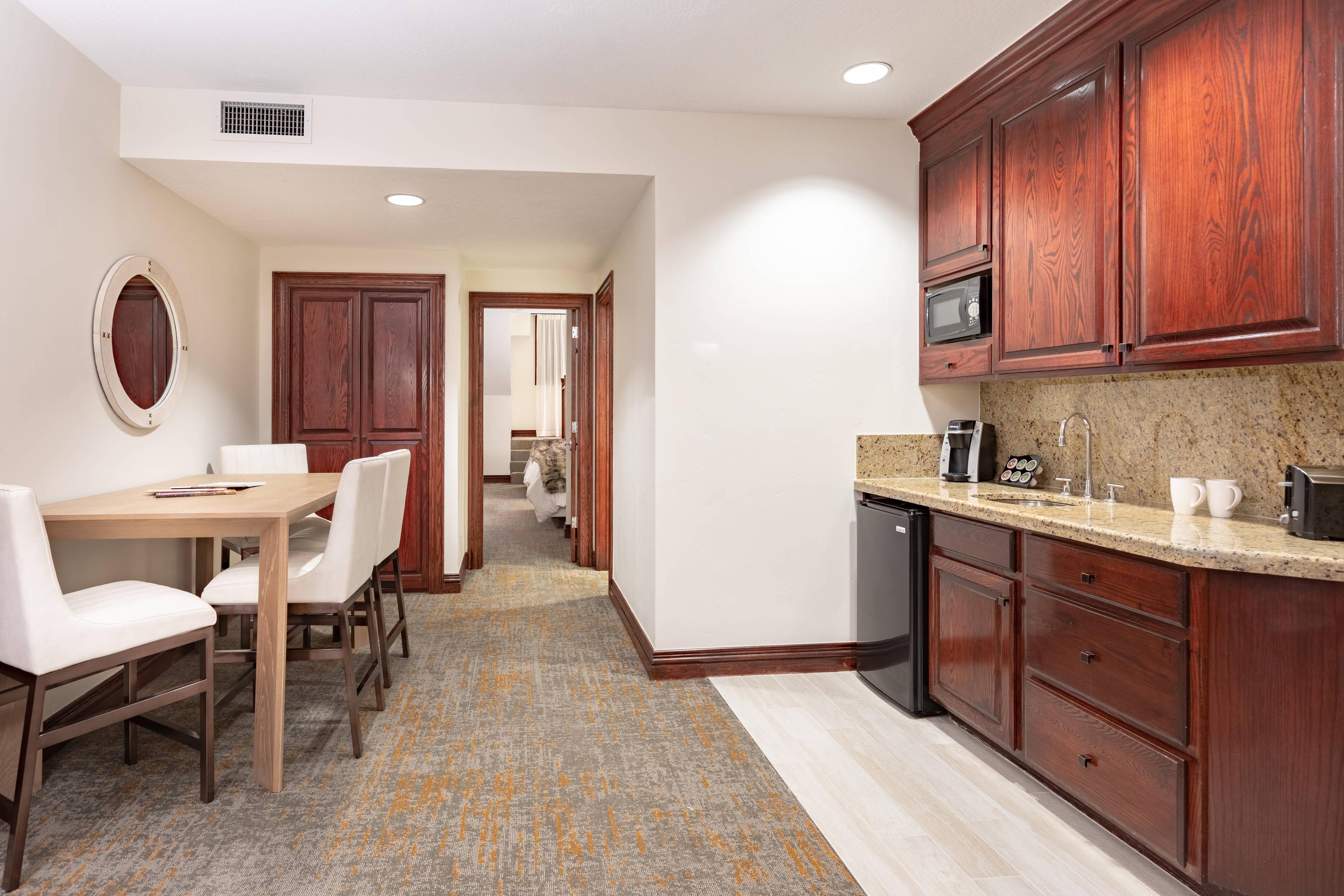 Our spacious double-queen suite comes with a kitchenette complete with a microwave, mini-refrigerator, coffee maker and seating area for convenient, in-room dining.