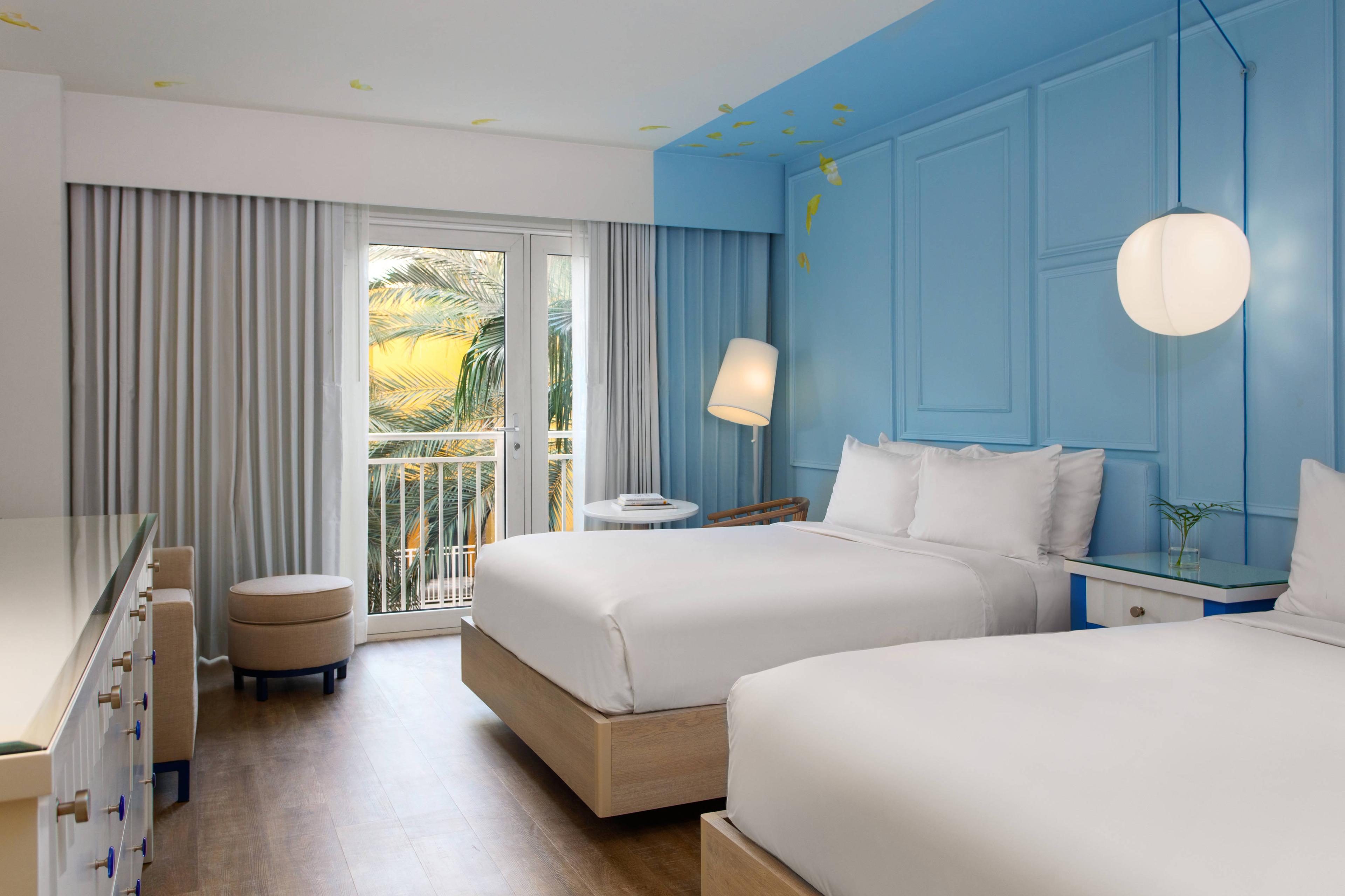 Style and comfort come together in our spacious rooms, offering two plush beds and resort views.