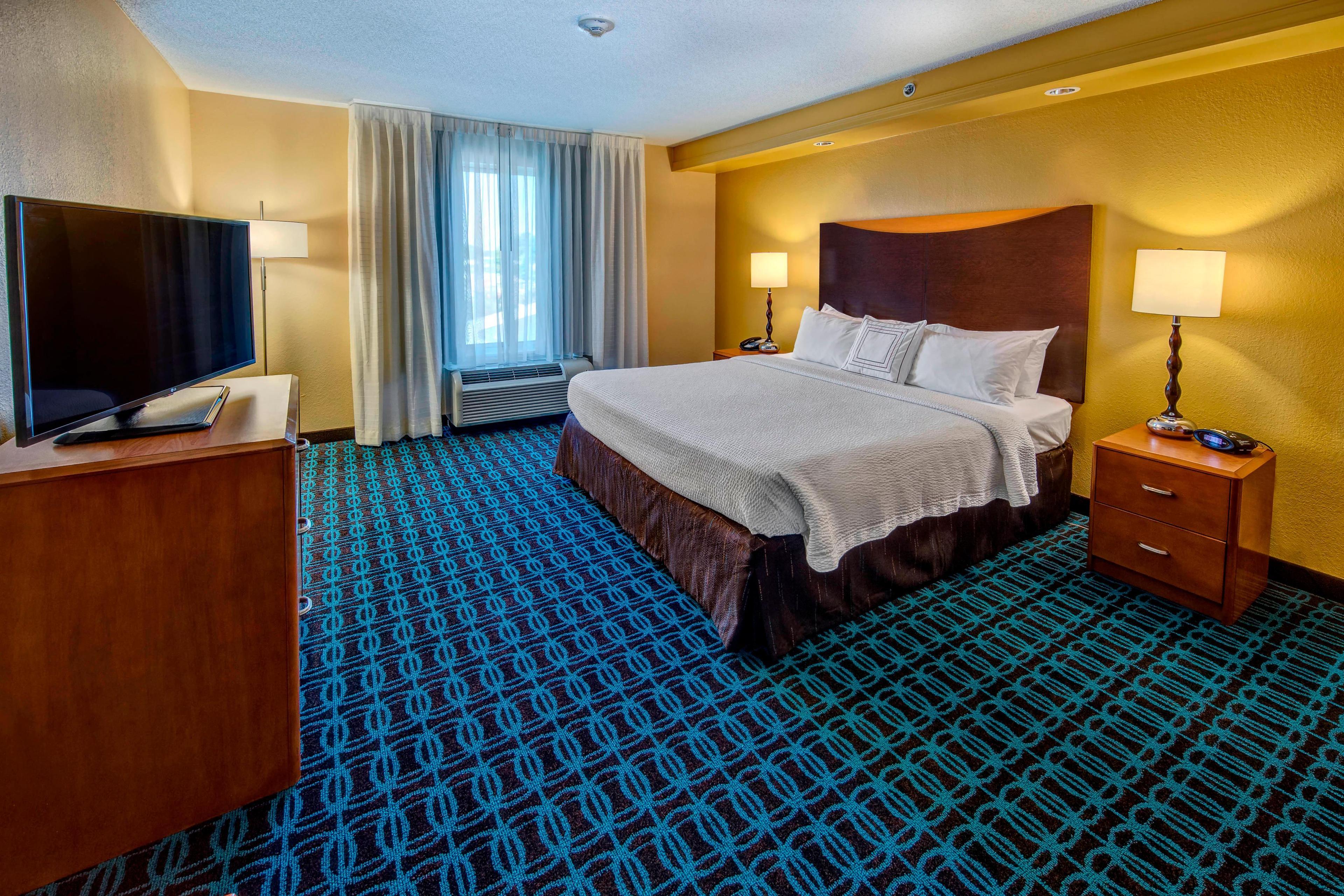 Spread out in a King Suite, which features a separate bedroom and living room filled with comfortable furniture for entertaining, plus a spacious work desk for taking care of business when working is a must during your stay.