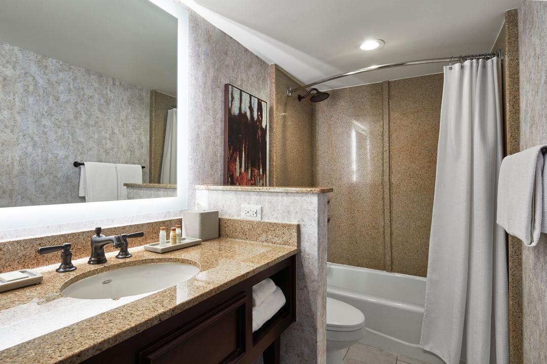 Get ready for your day in a stunning bathroom featuring modern amenities.