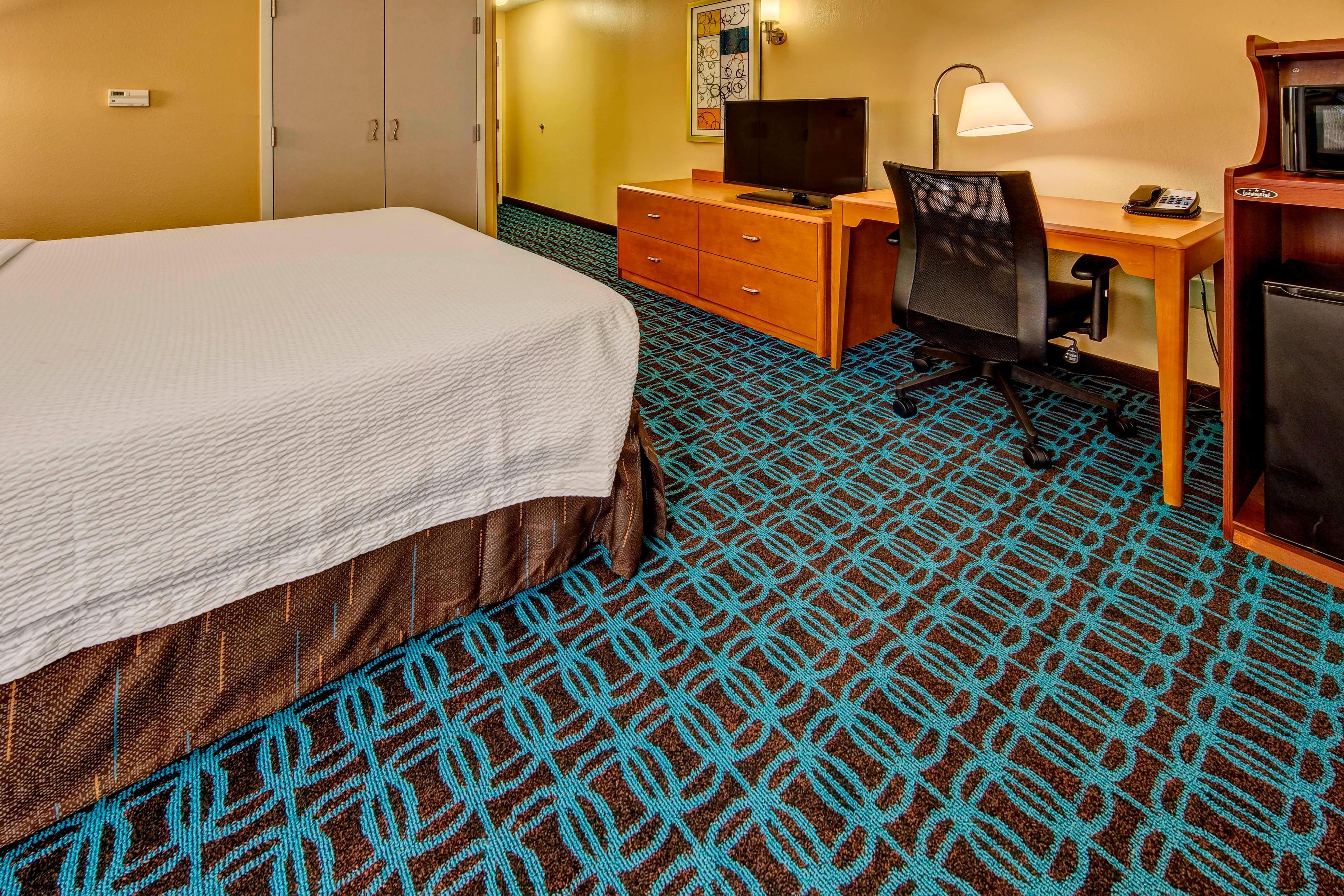 The king guest room features a 40-inch Smart TV, microwave and refrigerator. There is plenty of room to work at the desk with an ergonomic chair for comfort.