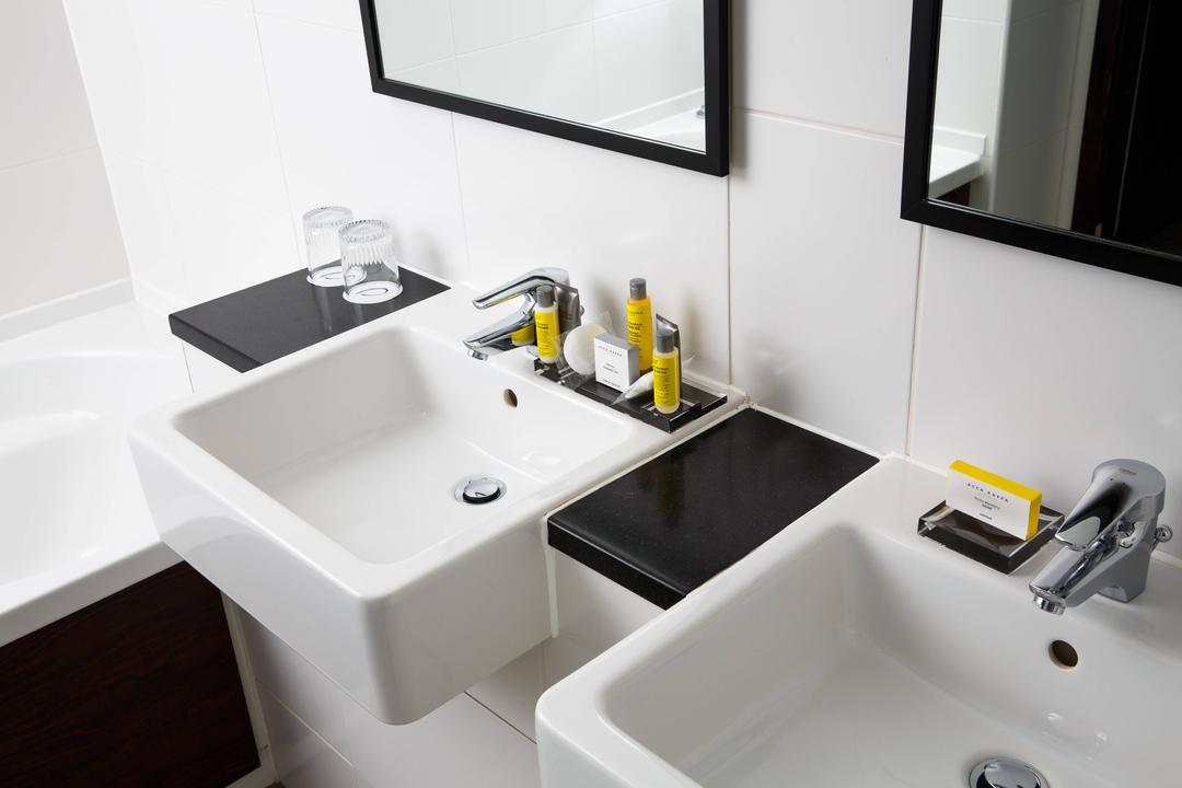 Twin sinks and mirrors make getting ready in the morning a breeze