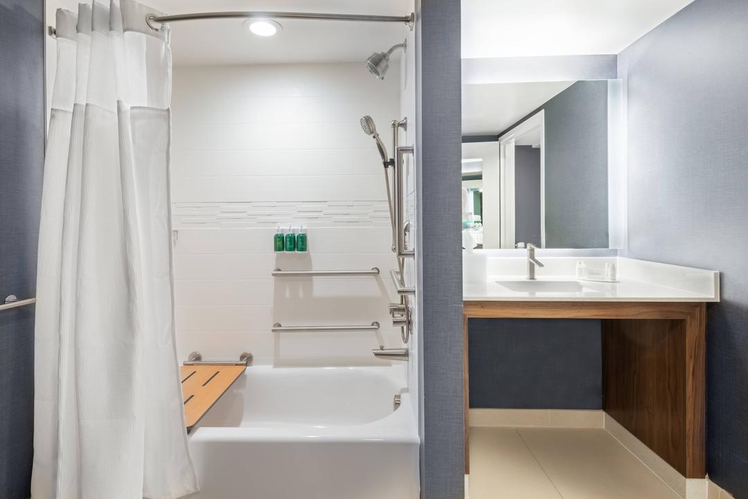 Select rooms offer accessible bathrooms which feature a tub with grab bars, an adjustable shower head and an in-shower seat.
