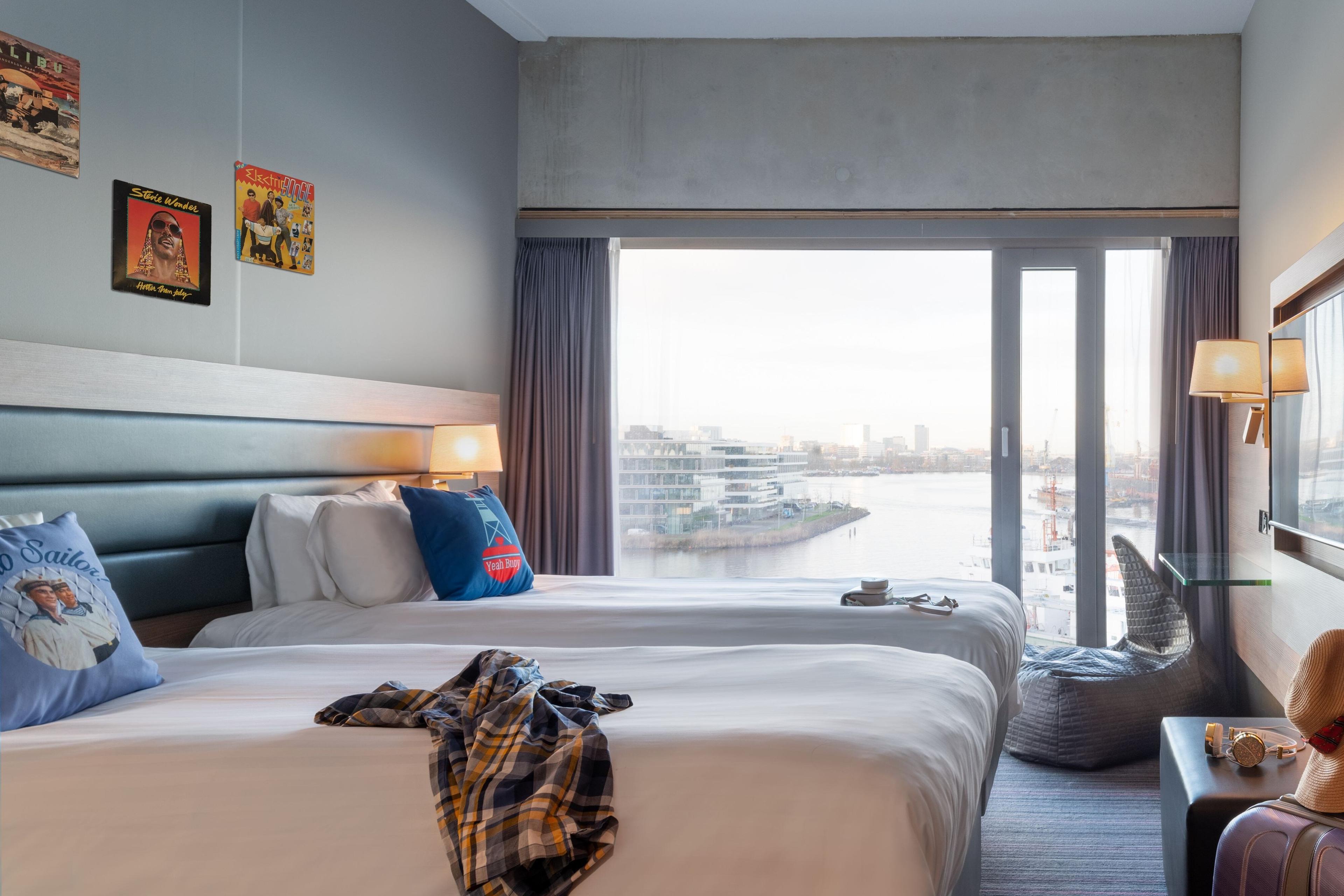 Moxy Sleeper Lookout Twin rooms will leave you stunned with floor-to-ceiling windows overlooking the IJ river and Amsterdam's western port.