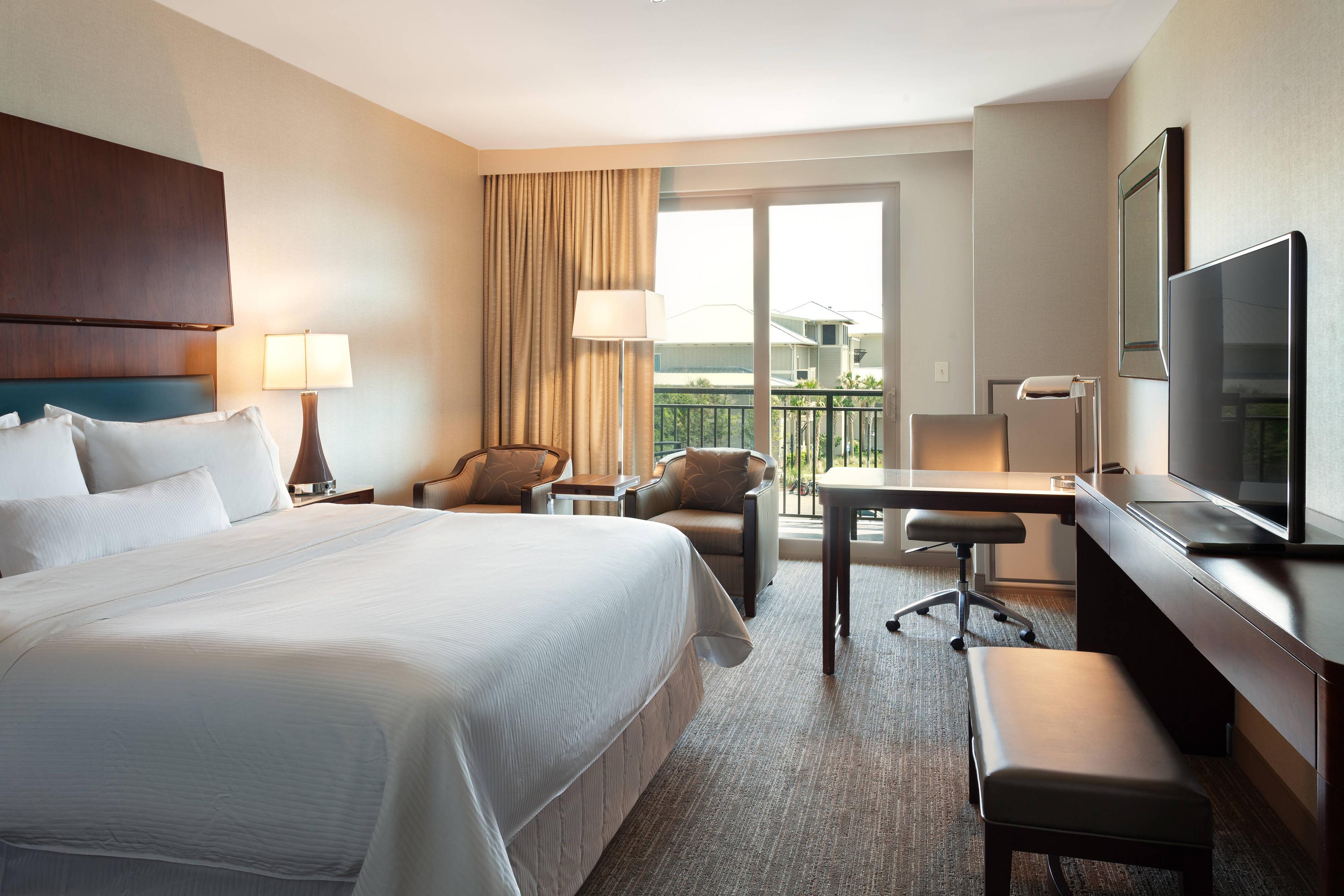 Our king partial-ocean view rooms boast views of the Atlantic Ocean, all while offering furnished step-out balconies and luxurious beds.