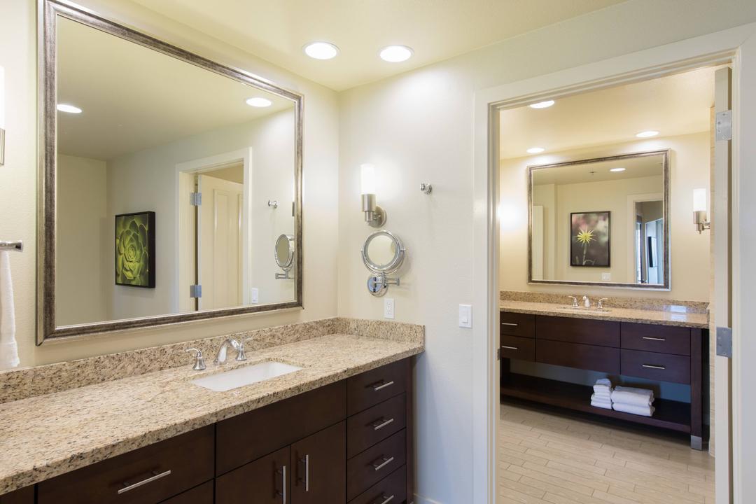 Villa master bathrooms feature two large vanity areas, a separate standing shower and an oversized soaking tub.