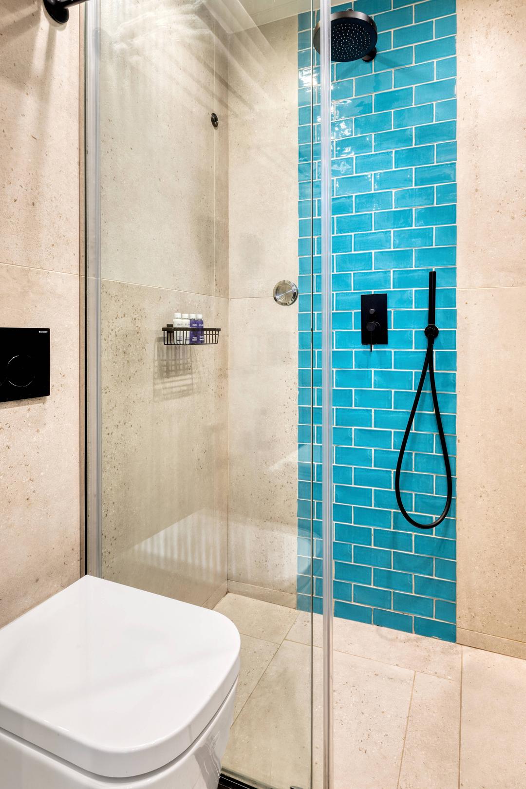 Uniquely designed bathrooms with a walking shower.