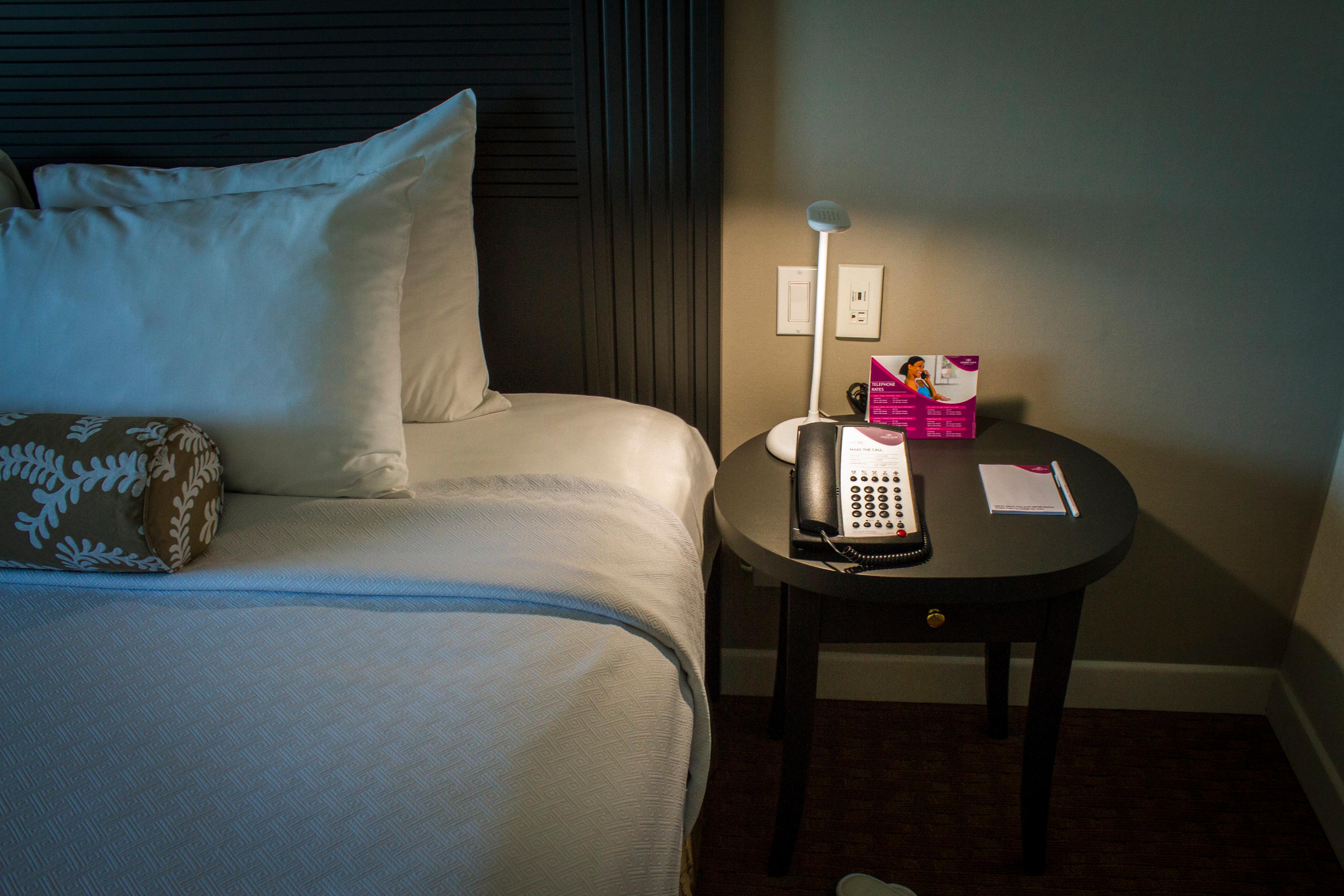 Wood sidetables flank the king-sized bed in the executive suites.