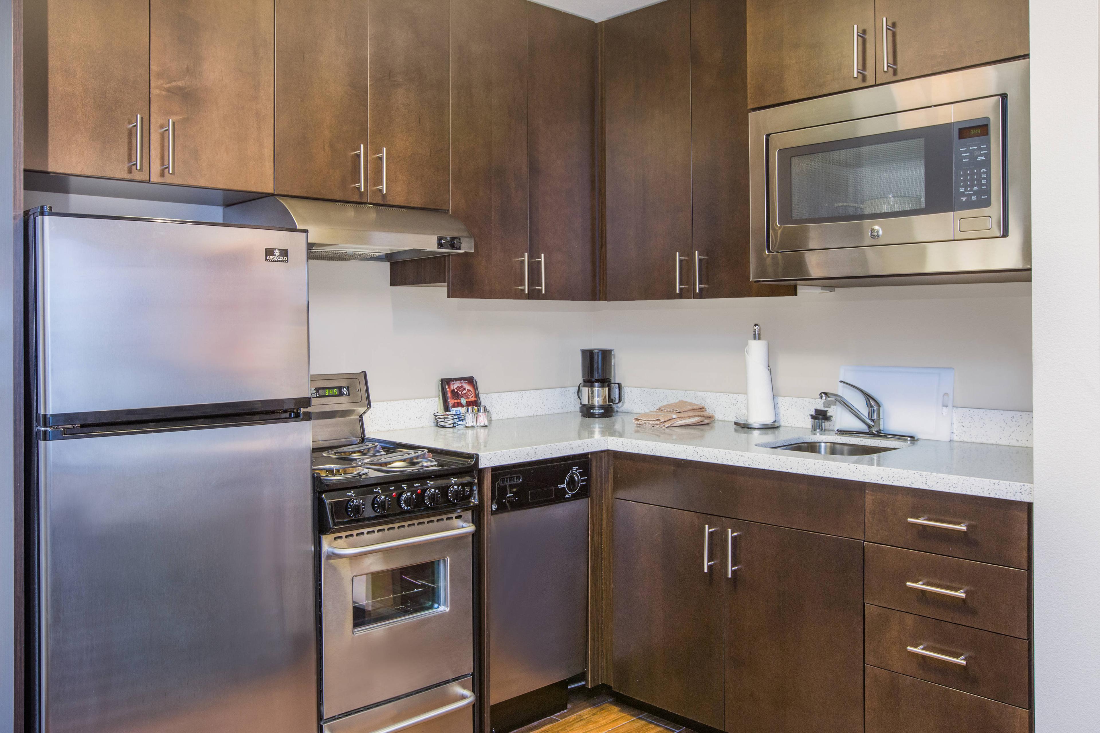 Our suites feature fully equipped kitchens with modern appliances.