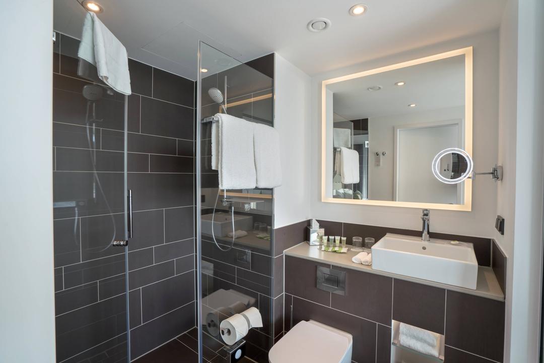 Our bathrooms have a big glass wall to let the daylight shine into the bathroom.