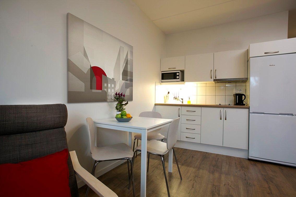 Our studio apartments is 17-19 sqm with fully equipped kitchenette with a stove, fridge with freezing compartment, microwave, kettle and dining table with chairs in a separate sitting area. 1 x 90 cm bed with pillow, duvet and bedlinnen. Modern bathroom with a shower and towels. Free Wi-Fi and Smart-TV in every apartment and wardrobe with mirror door. Laundry room with iron and ironing boards and garbage room on each floor. Free access to the gym Puls & Traning.