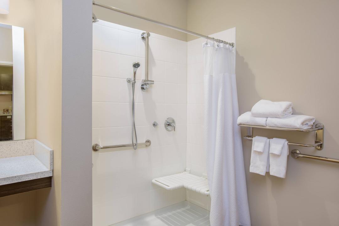 Get ready with space for all your things in our bathroom and vanity area. Granite counter tops and bright lighting make it easy to look your best. Our accessible roll in showers feature spacious showers with fold down bench for when you need it and height adjustable shower heads.