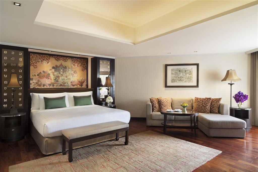 King-sized bed and lounge in the Deluxe Junior Suite