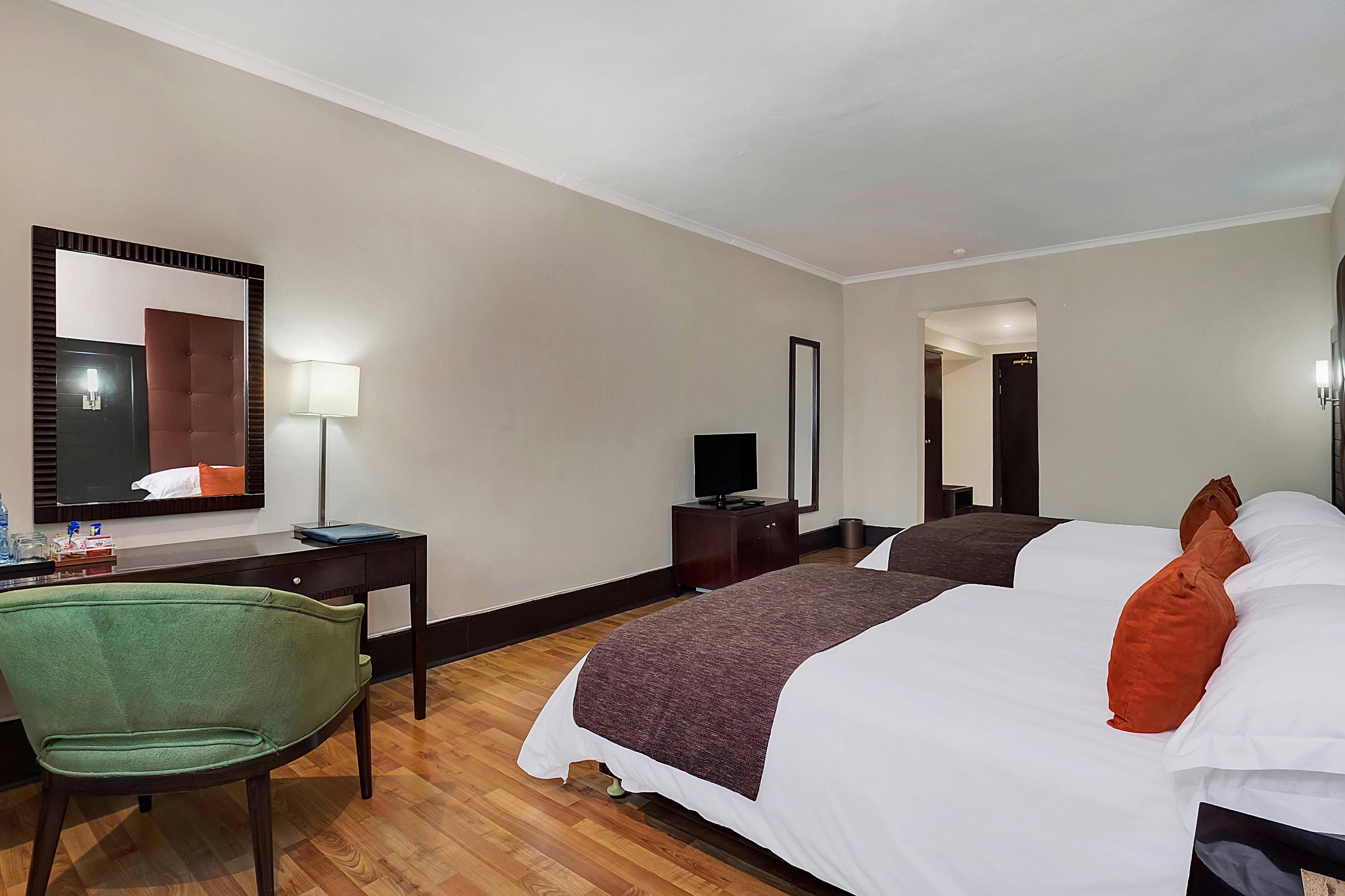 Relax and unwind in one of our comfortable queen/queen guest rooms. These spacious rooms feature a flat-screen TV, coffee and tea maker and an ergonomic work desk.