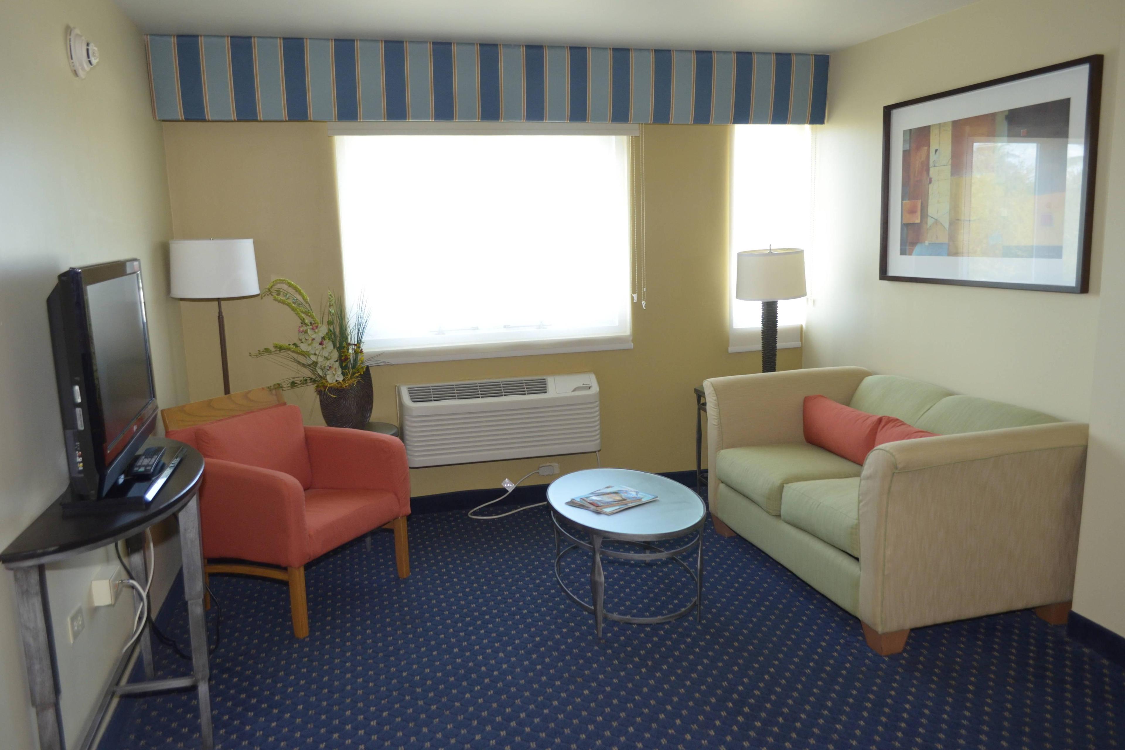 Our comfortable Junior Suite living room has a seating area with a full size bed, a/c, cable TV with HBO and free wifi.