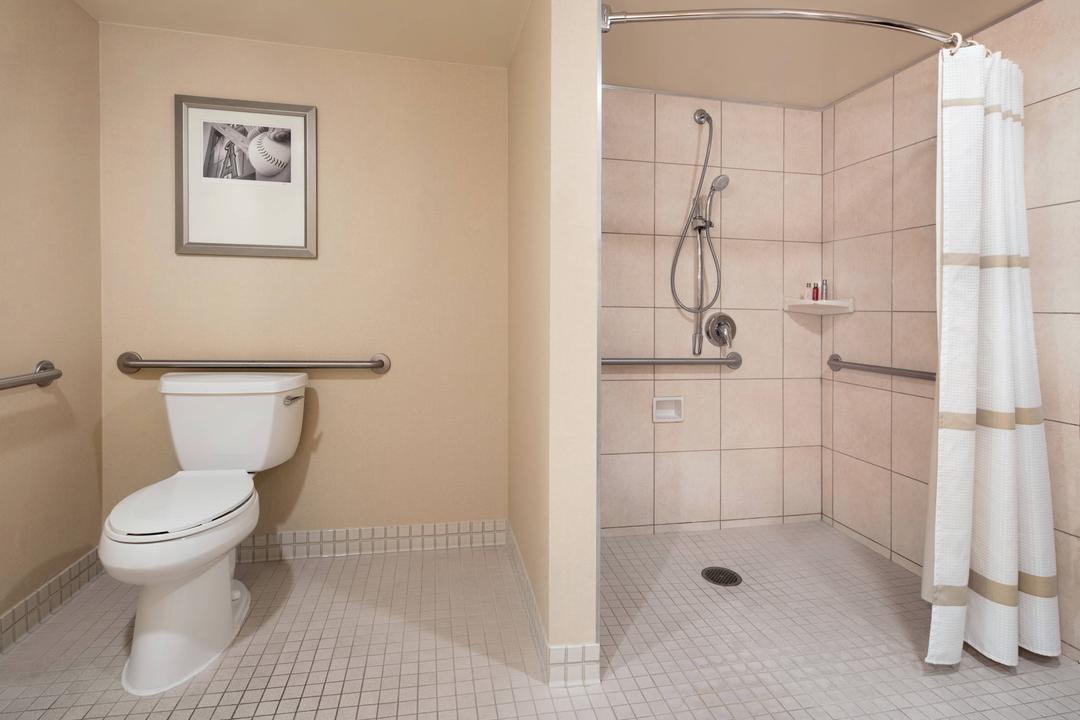 Our accessible bathroom with roll in shower features access from both the bedroom and the living room.