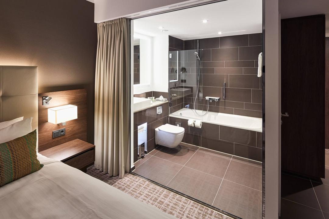 Our bathrooms have a big glass wall to let the daylight shine into the bathroom.