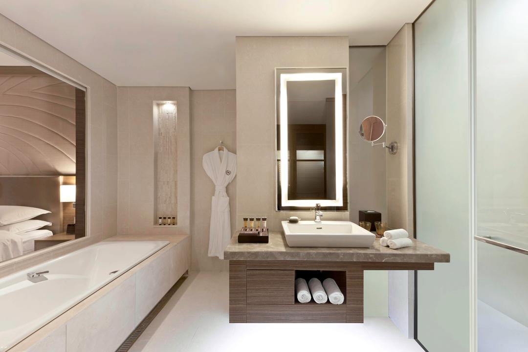 Pamper yourself during your stay in D Cube City in our modern bathrooms, showcasing a separate bathtub and shower, a spacious vanity and complimentary bathrobes.