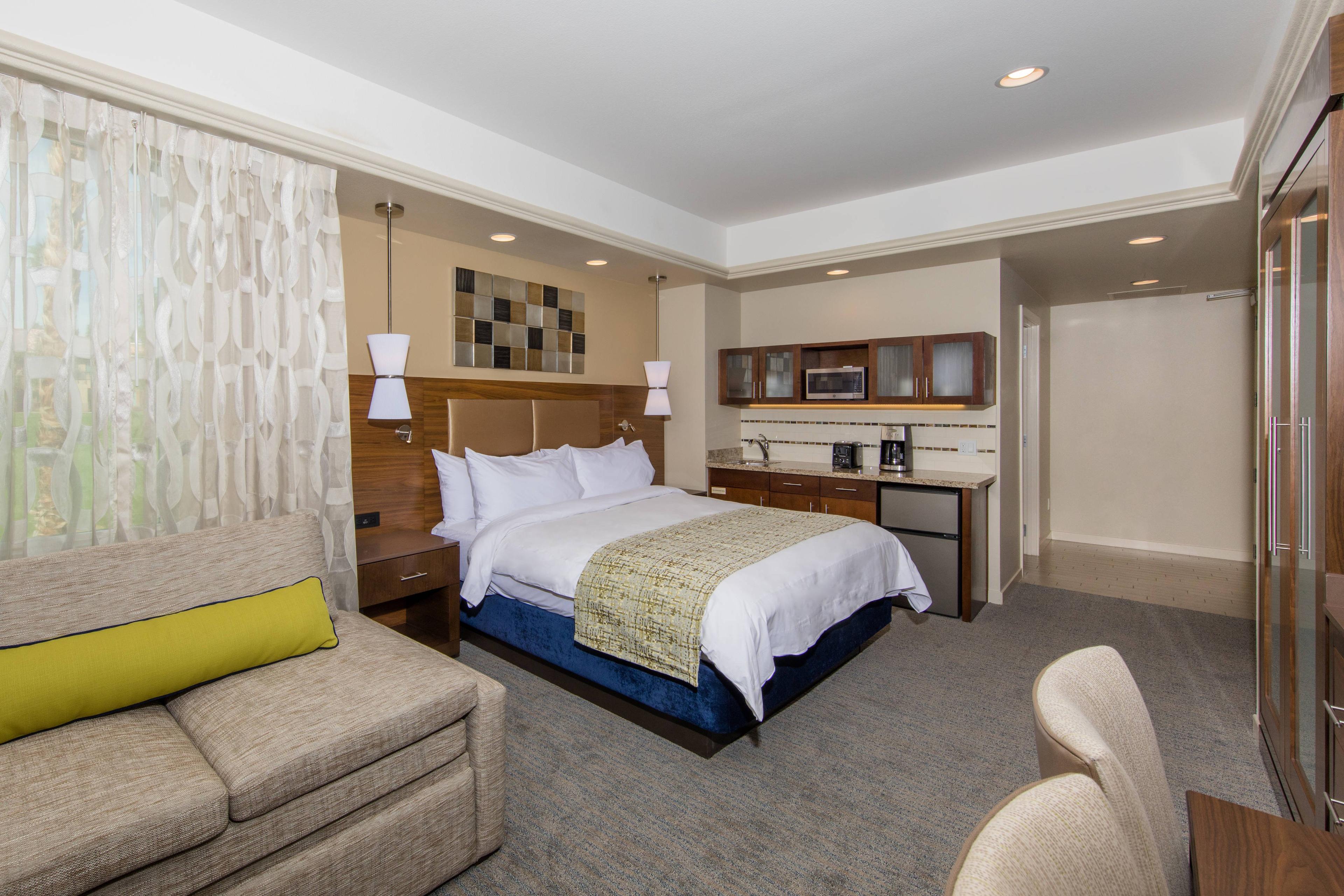 Comfortable guest rooms include a king bed, a sofa bed and a kitchenette with mini refrigerator, microwave and dishware.