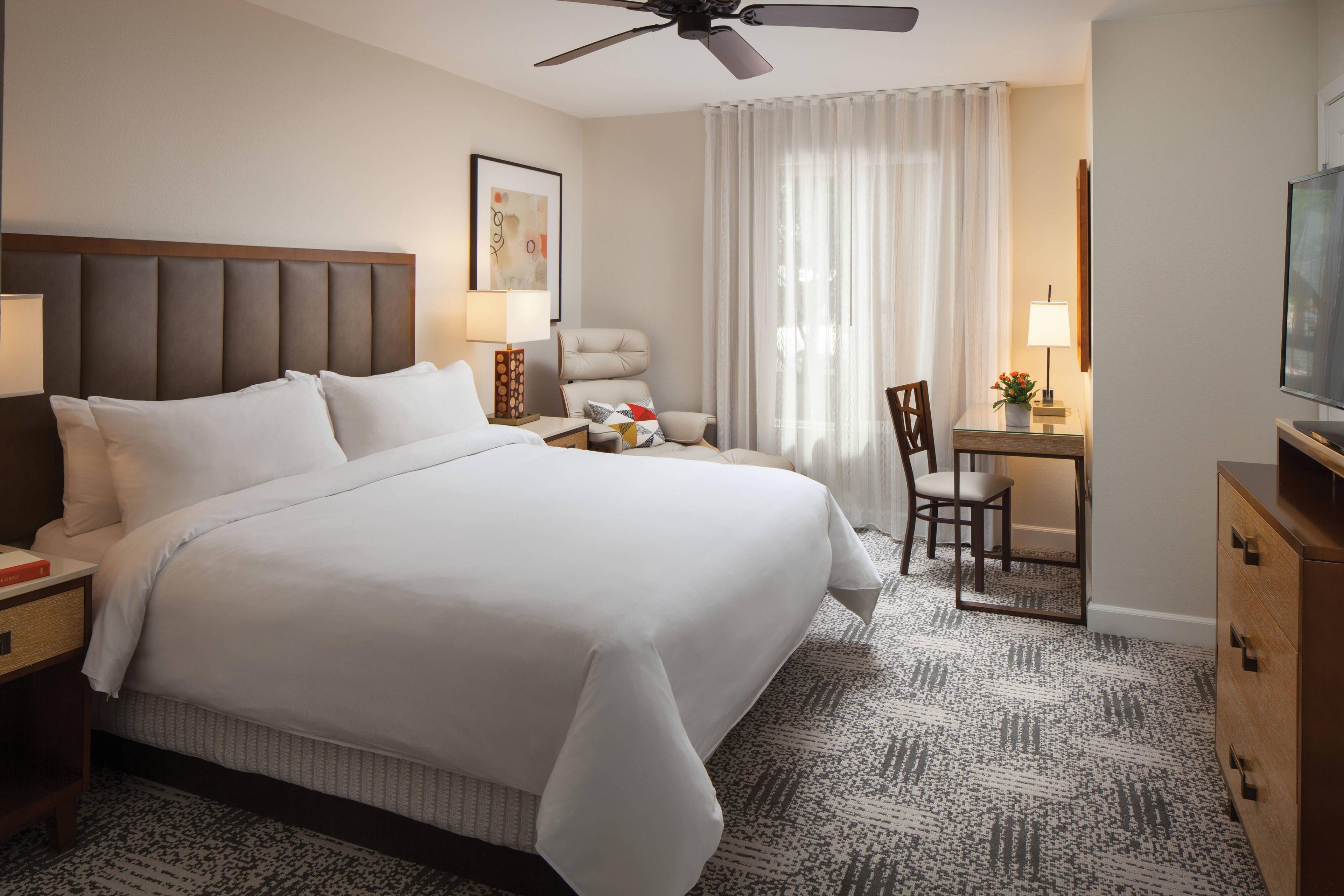Relax and unwind in the comfortable master bedroom with a king-size bed and a private bath.