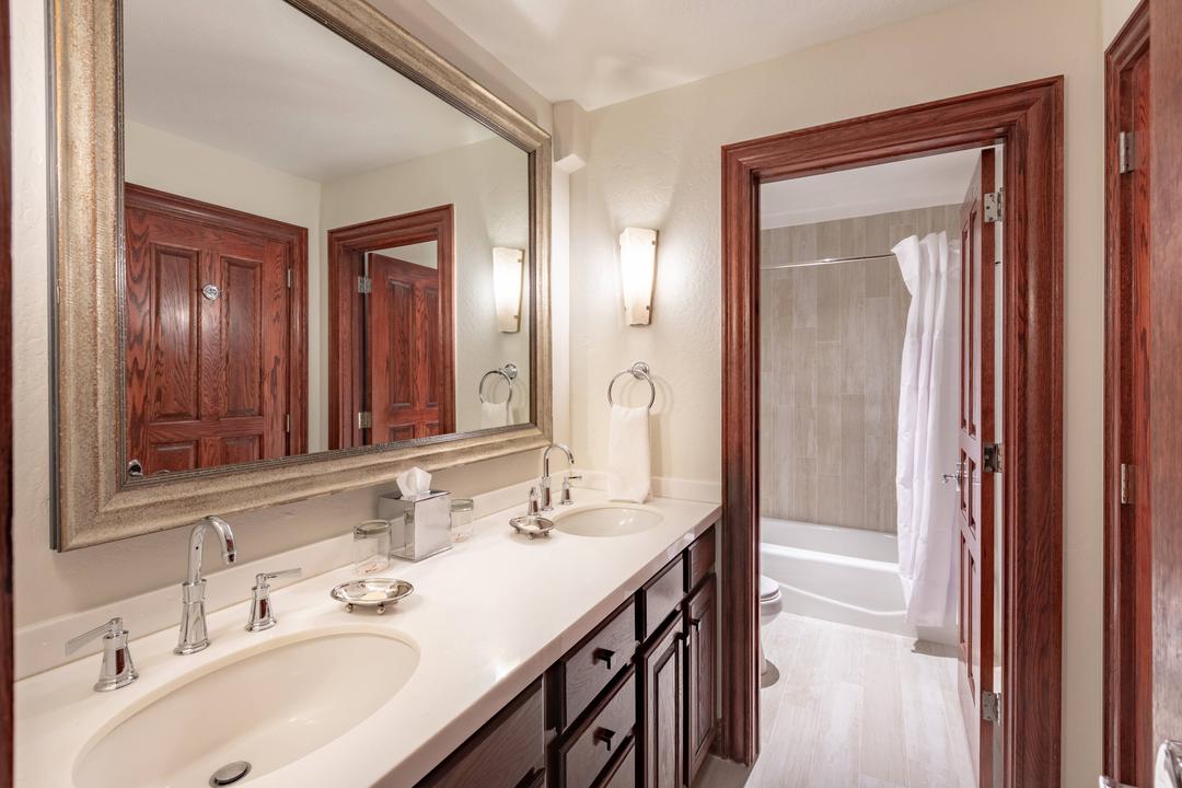 Lavish in your suite's well-lit bathroom, equipped with custom scented amenities, a large mirror and spacious countertop for spreading out your toiletries.