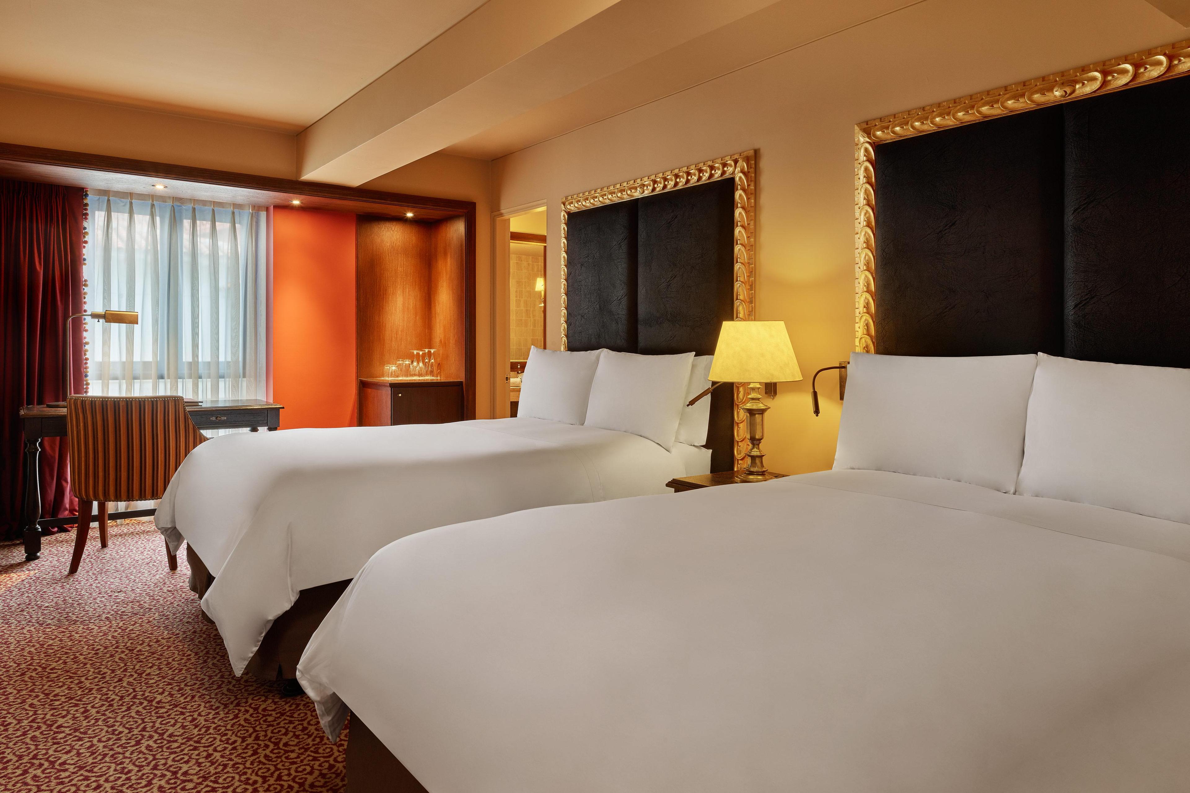 Enjoy spacious accommodations for up to 4 guests in our Premium Guest Rooms with two twin beds.