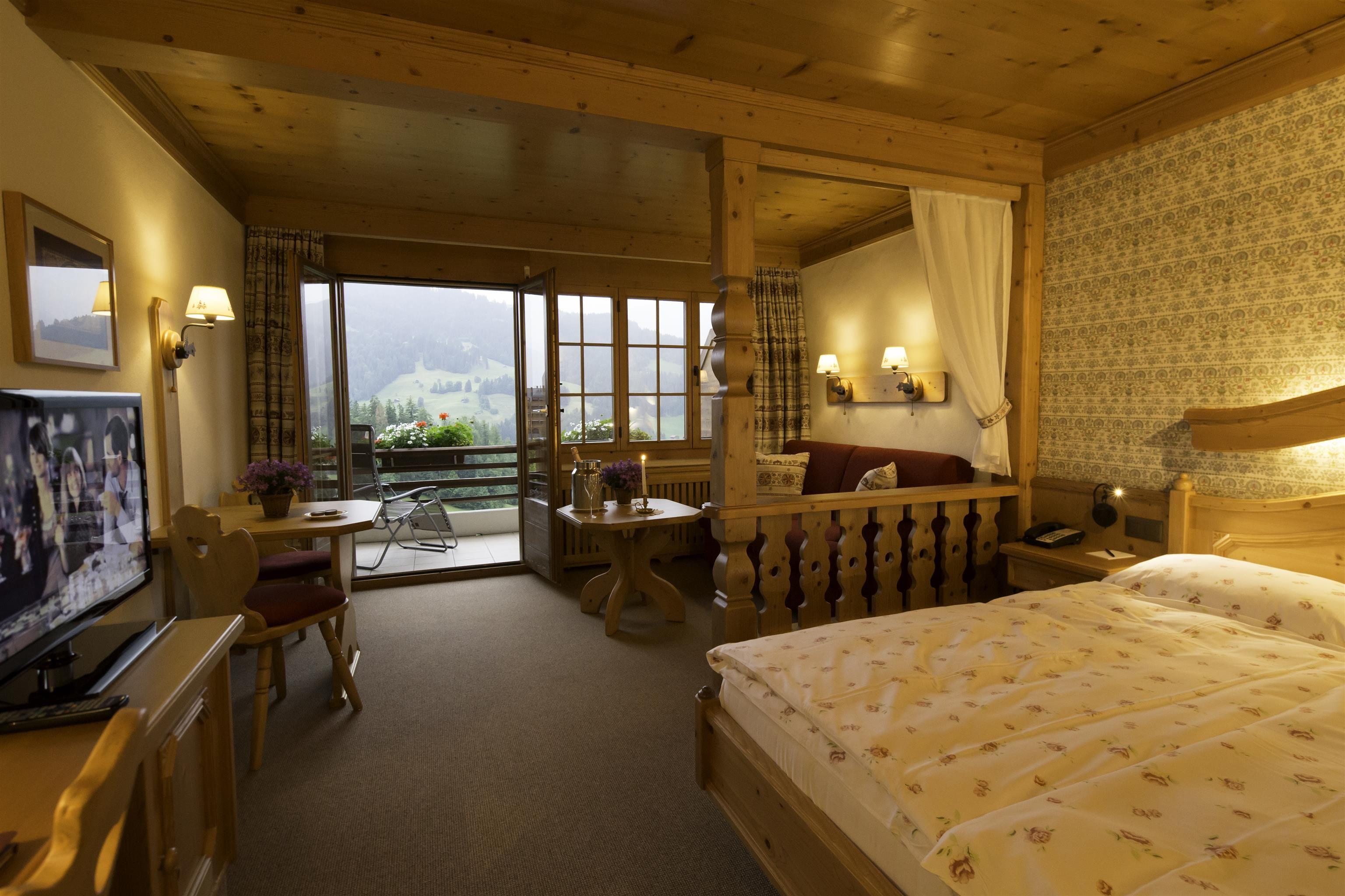 Comfortable double room, decorated in typical chalet style with a seating area and a balcony facing south, east or west side with stunning views over Gstaad or Saanen and the surrounding mountains. Bathroom with bath or shower. Single Occupancy.