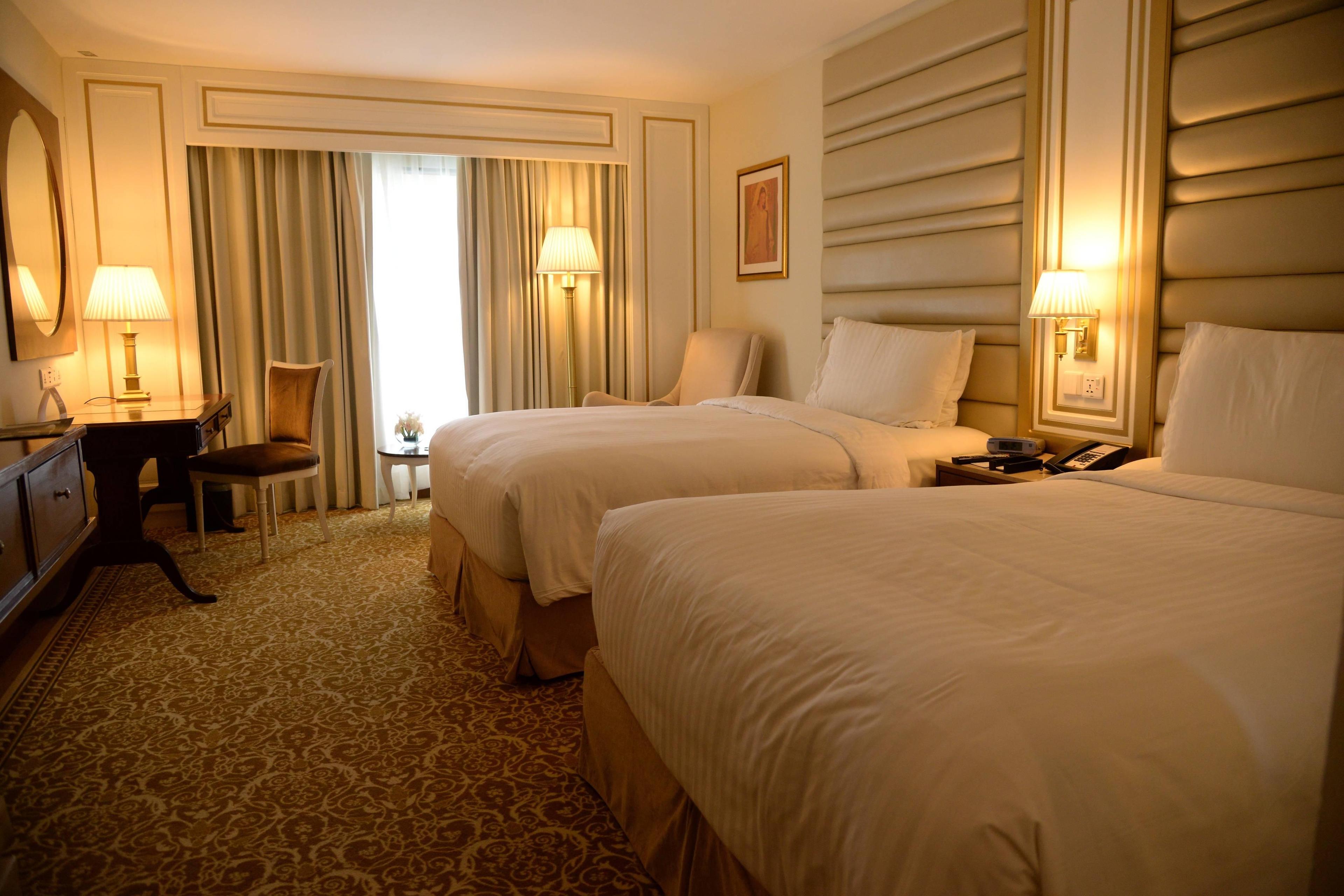 Our Executive Twin Guest rooms are made for your comfort featuring twin beds, a work desk and a smart TV.