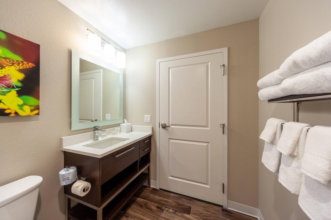 Get ready with space for all of your things in our bathroom and vanity area. Granite counter tops and abundant storage and bright lighting make it easy to look your best.