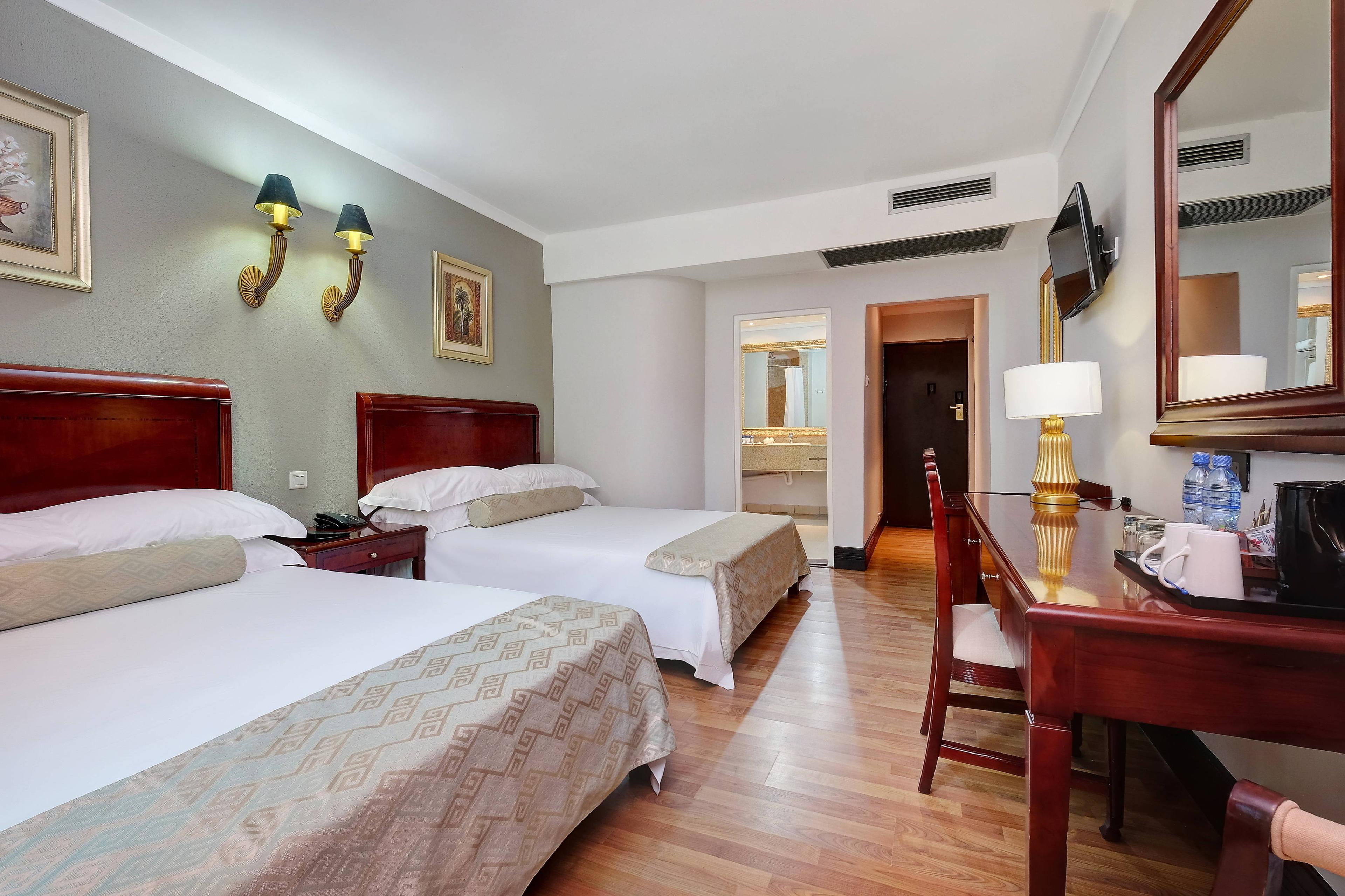 Protea Hotel Livingstone offers 40 deluxe guest rooms with two queen beds, a work desk and a wall-mounted flat-screen TV.