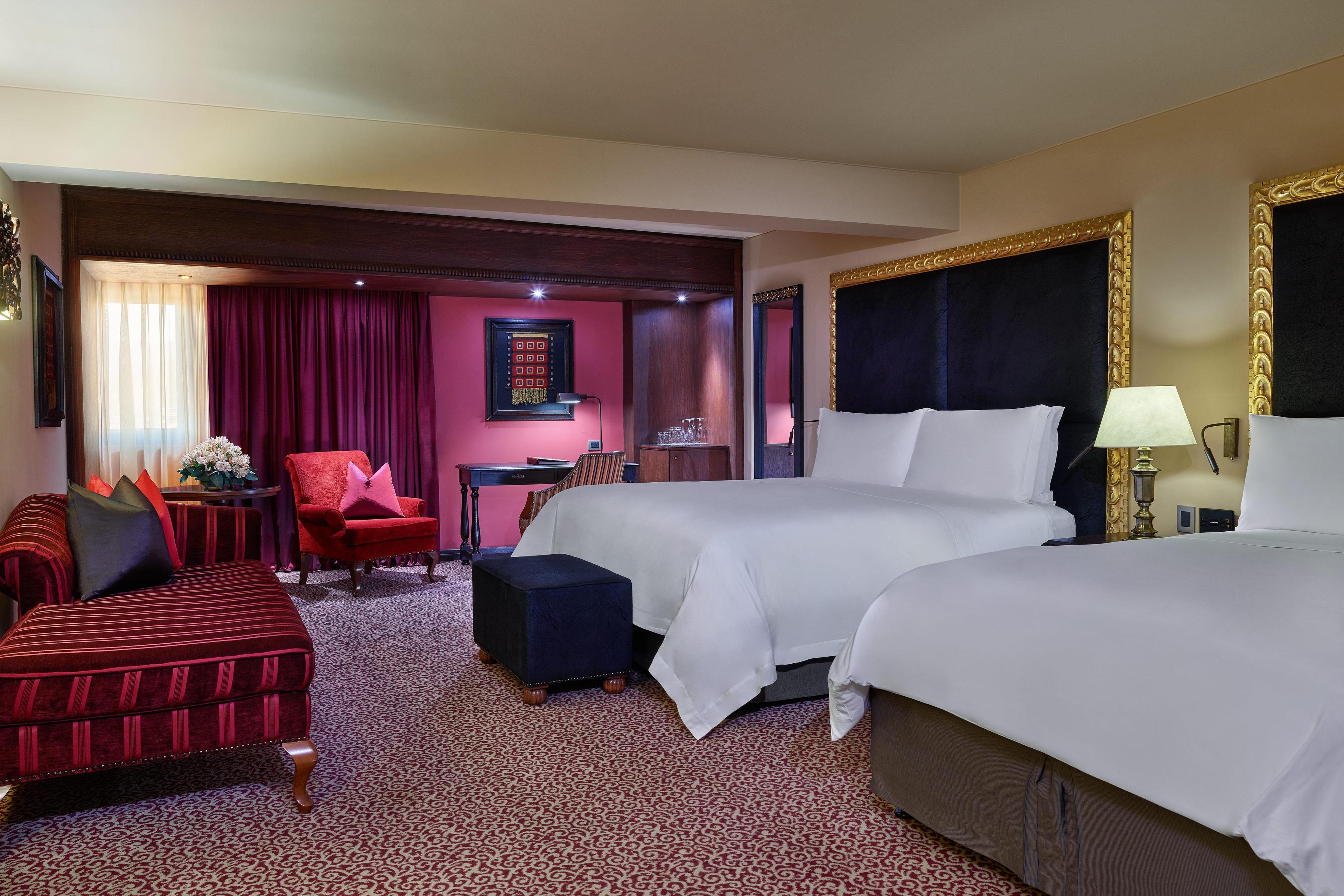 Our Deluxe Guest Room has two double beds for the whole family to relax and unwind in.