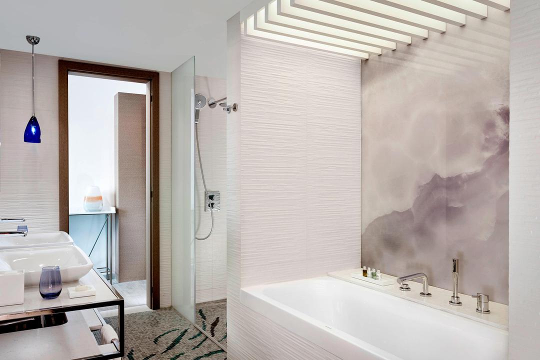 Bright, cheerful lighting and elegant mosaic design touches adorn the executive king guest bathroom. Rejuvenate with a power shower or take a long, luxurious soak in the oversize tub.