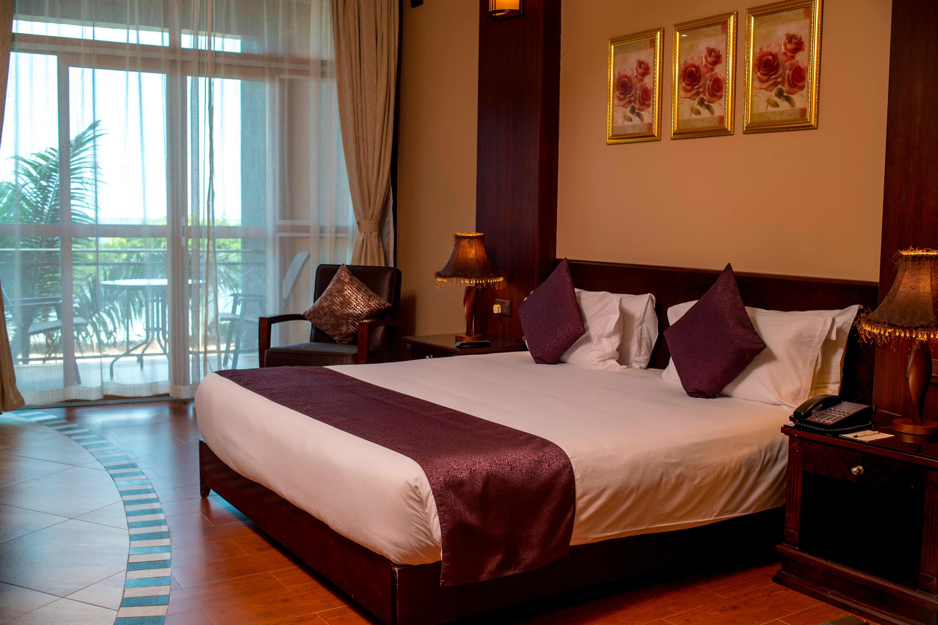 Enjoy spectacular views of Lake Victoria from the 1 Queen Guest Room with a balcony.